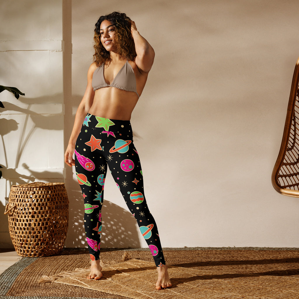 Women’s neon galaxy buttery soft black leggings with vibrant space-themed planets stars and comets pattern