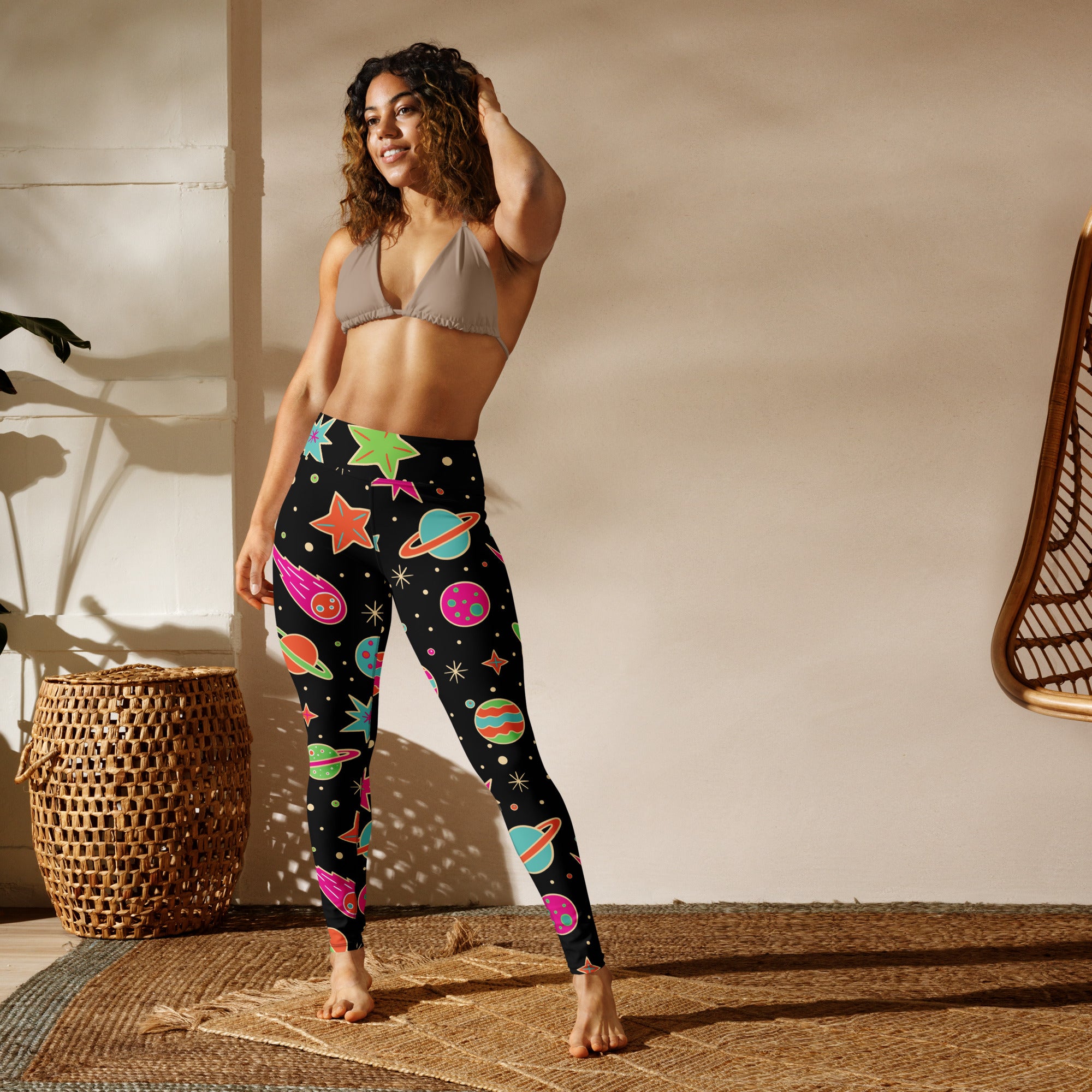 Women’s neon galaxy buttery soft black leggings with vibrant space-themed planets stars and comets pattern