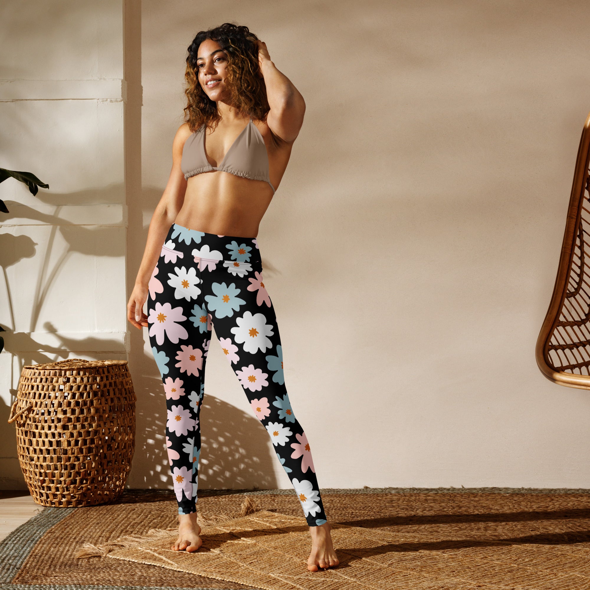 Women’s retro floral buttery soft black leggings with vibrant white pink and light blue daisy pattern for yoga