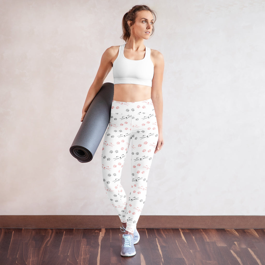 White buttery soft women’s yoga leggings with playful pink and gray cat faces and paw print pattern