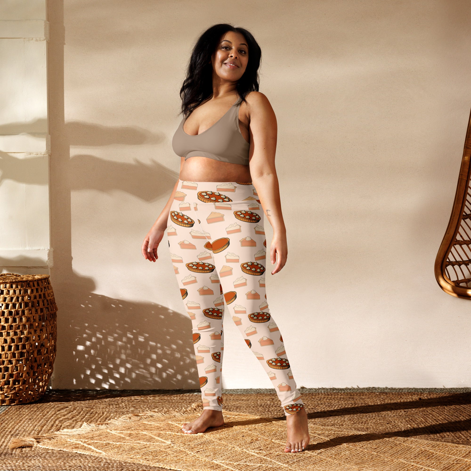 Cream-colored buttery soft women’s yoga leggings with playful pumpkin pie pattern in warm brown orange and beige tones