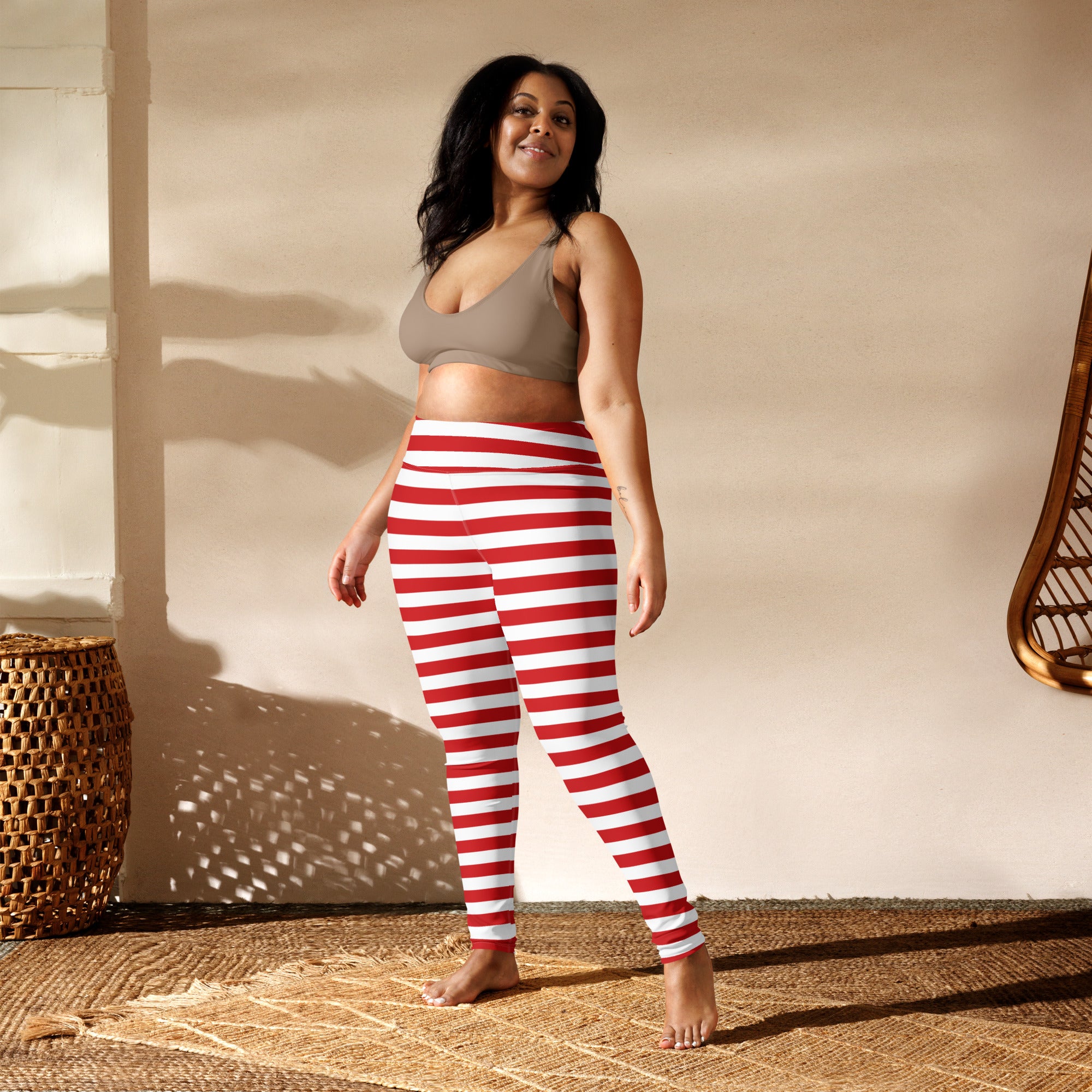 Women’s red and white striped buttery soft yoga leggings made of stretchy fabric for comfortable activewear