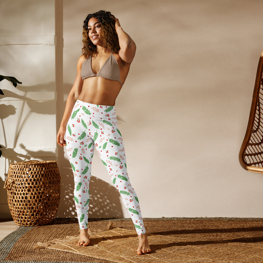White buttery soft women’s yoga leggings with green leaf and red berry winter pattern for cozy wear