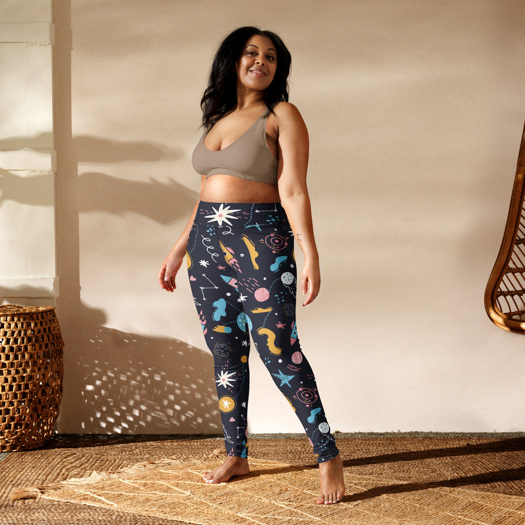 Dark blue women’s outer space buttery soft yoga leggings with colorful rockets stars planets and constellations pattern