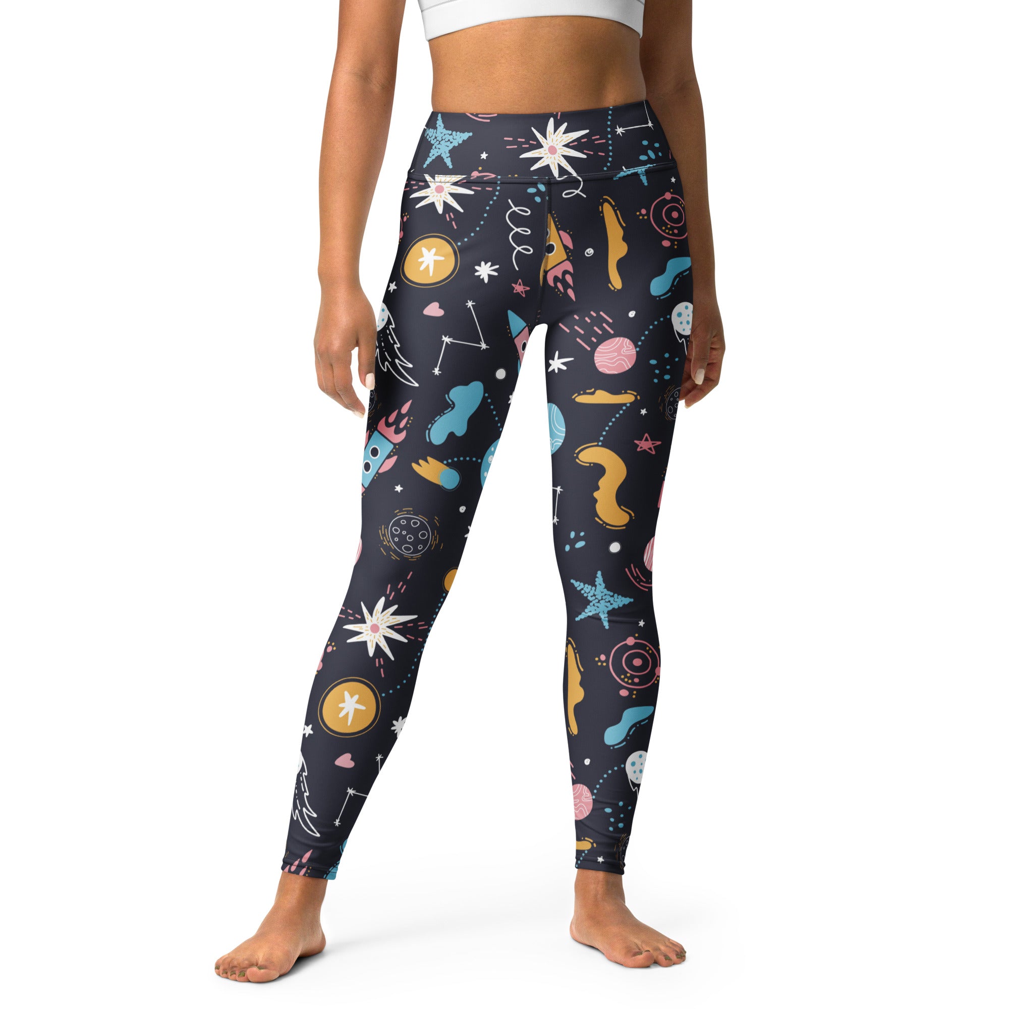 Women’s outer space buttery soft yoga leggings in dark blue with colorful pastel planets stars and rockets print