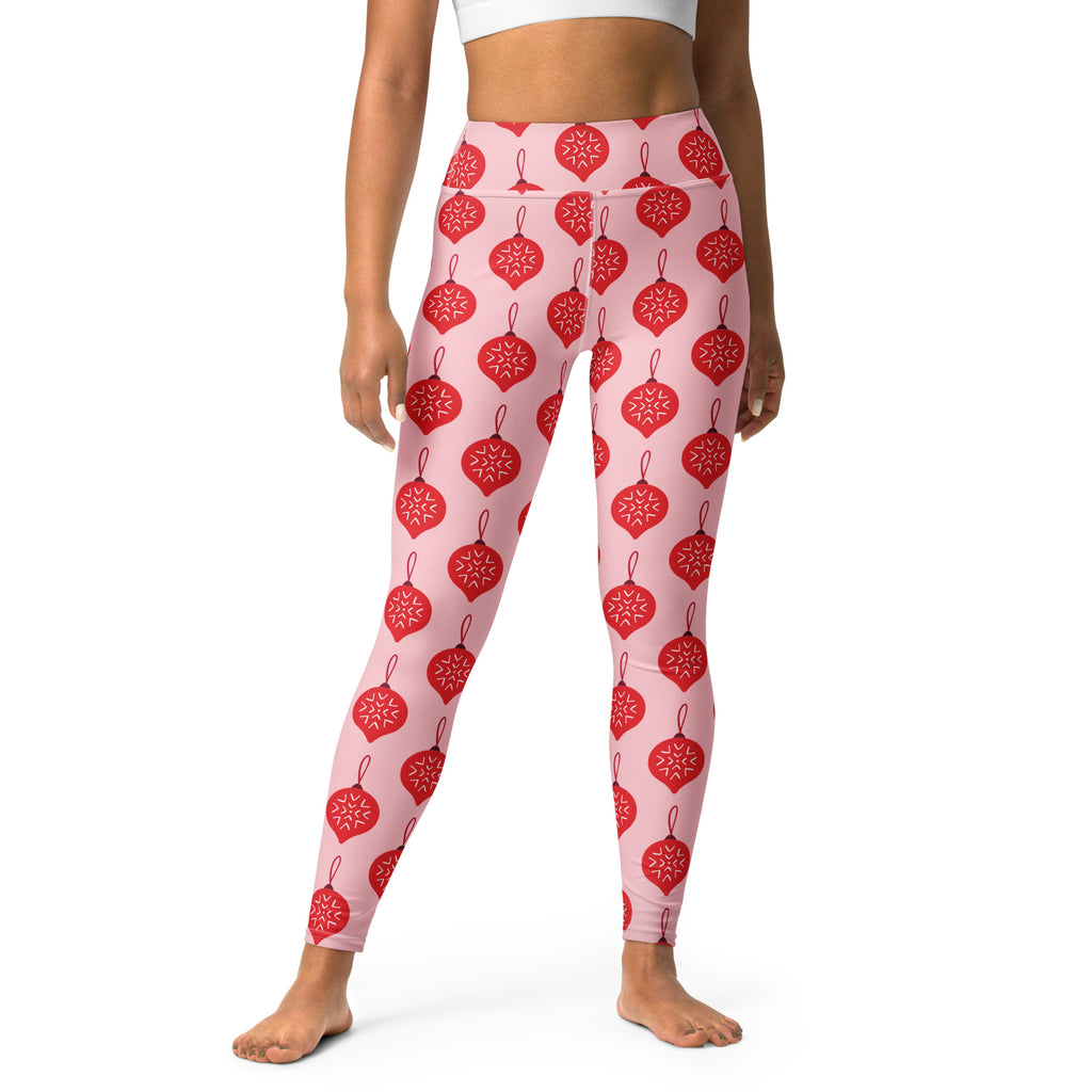Women’s pink buttery soft yoga leggings with red christmas ornament and white snowflake pattern