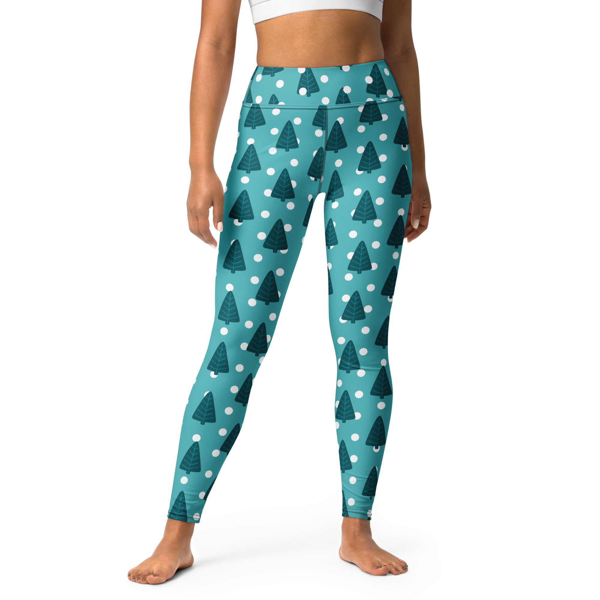 Women’s teal high waisted buttery soft yoga leggings with dark green pine tree and white polka dot pattern