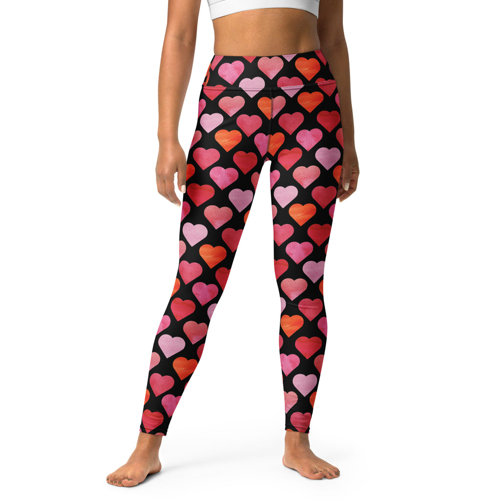 Women’s high waisted buttery soft black leggings with vibrant pink coral and red watercolor heart pattern for yoga