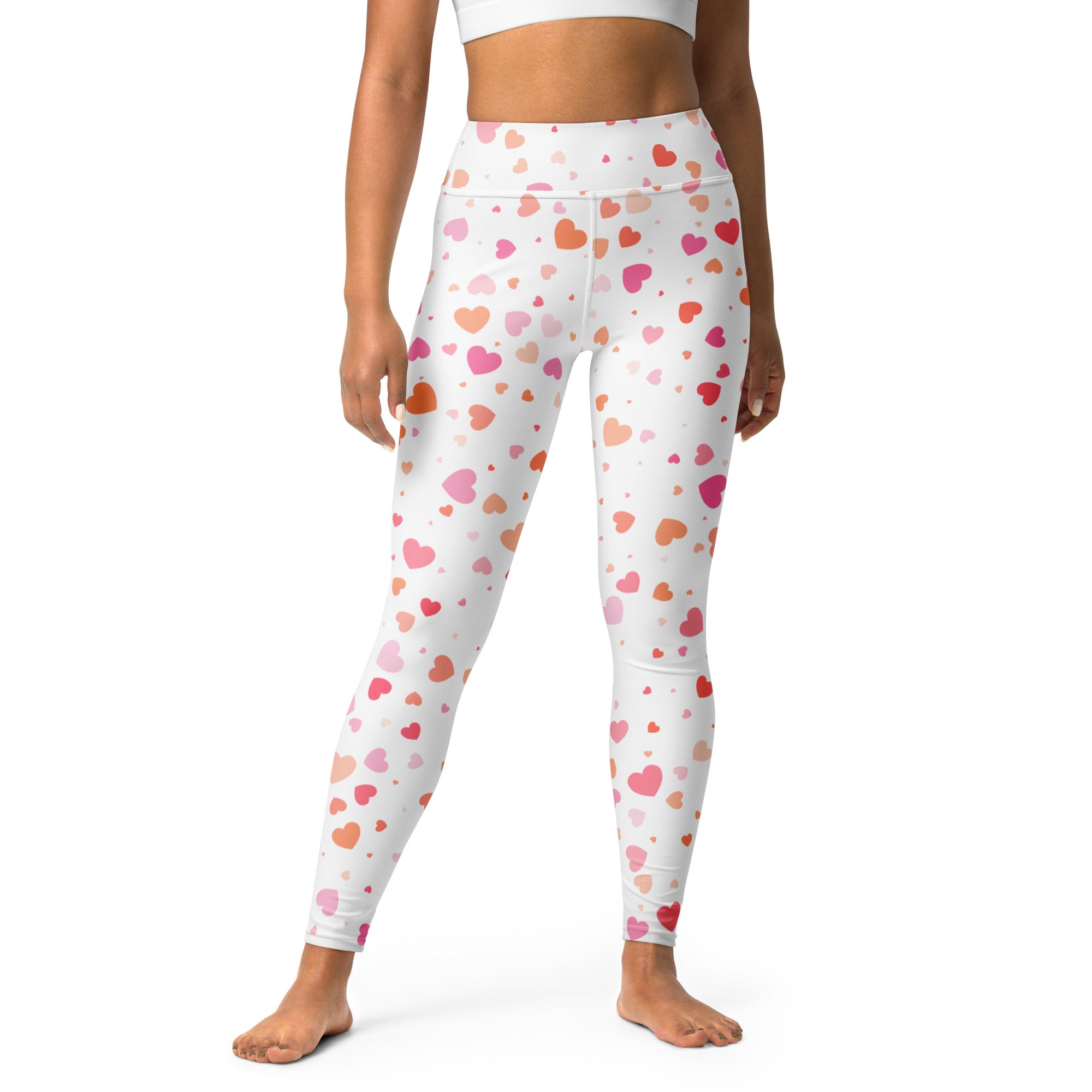 White buttery soft high waisted yoga leggings with quick drying fabric and pink peach coral heart pattern