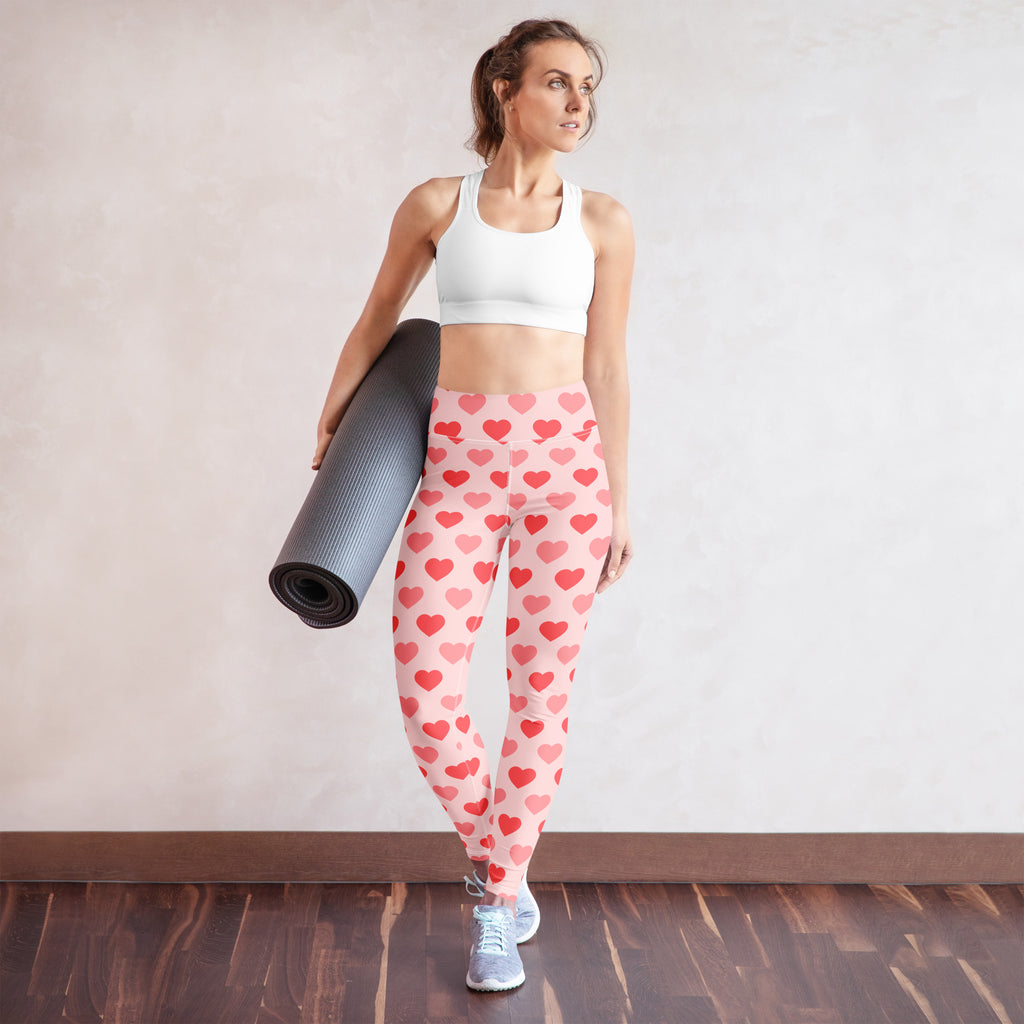Women’s pink and red heart patterned high waisted yoga leggings made from buttery soft quick drying fabric