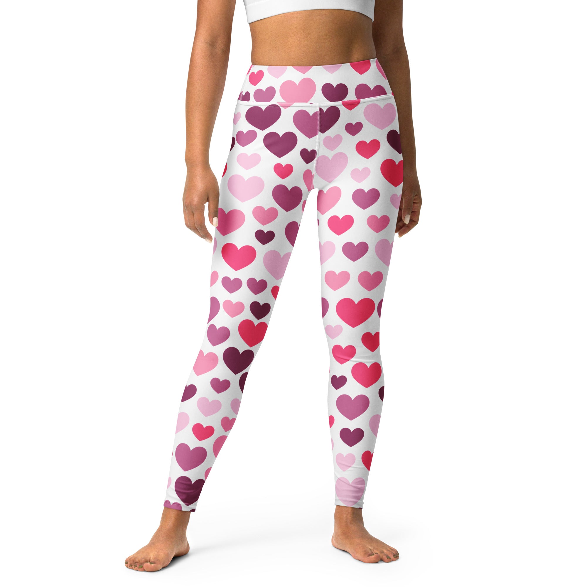 White high-waisted women’s leggings with pink and purple heart pattern buttery soft quick drying fabric