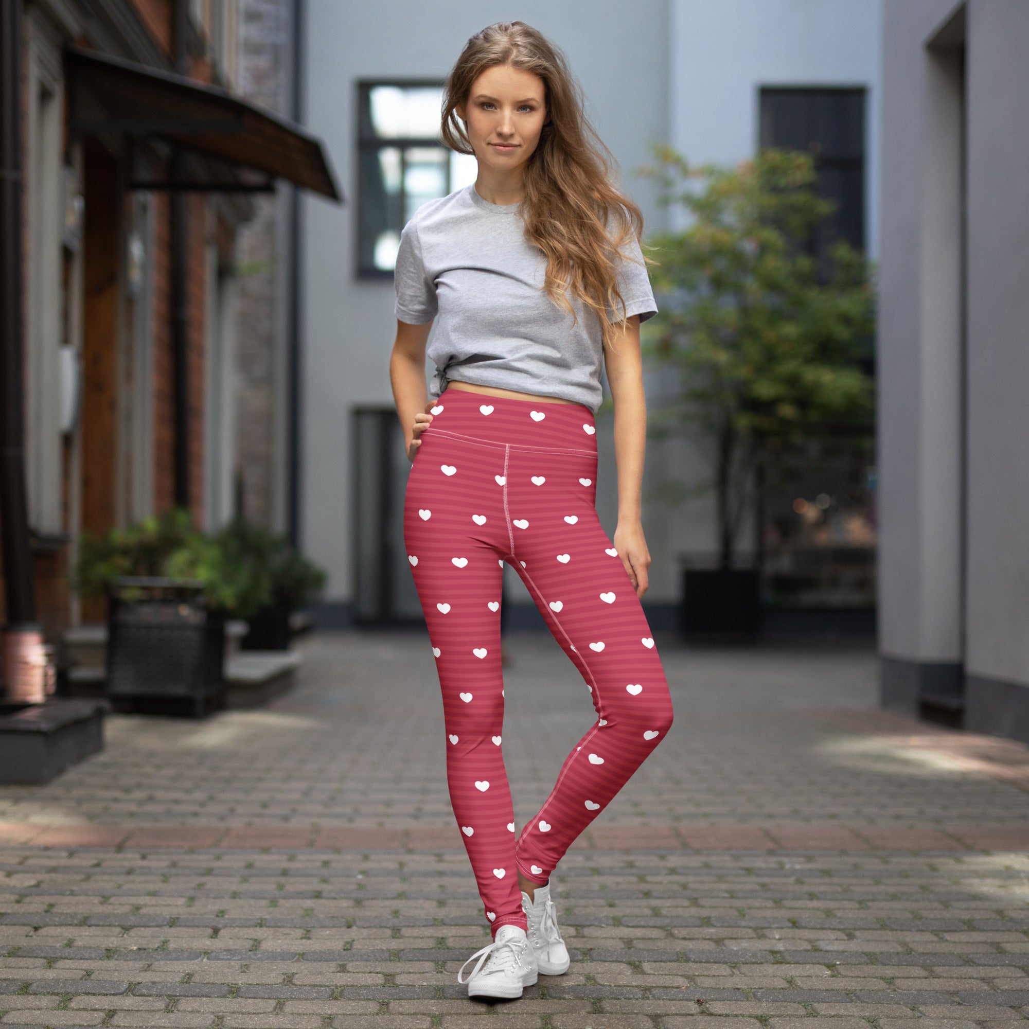 Women’s fuchsia heart-patterned buttery soft high waisted yoga leggings with white stripes and quick drying fabric