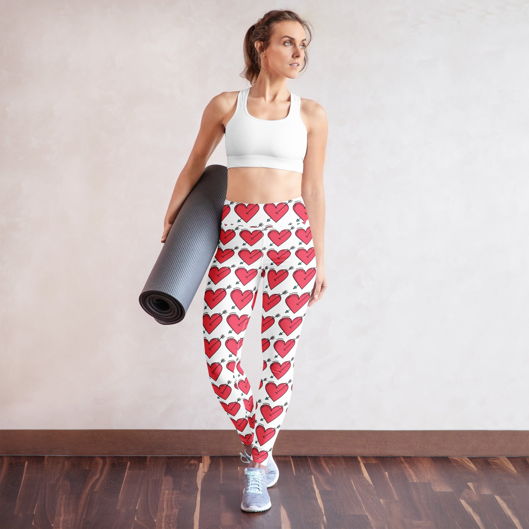 Women’s white buttery soft high waisted yoga leggings with red hearts and black arrow pattern quick drying
