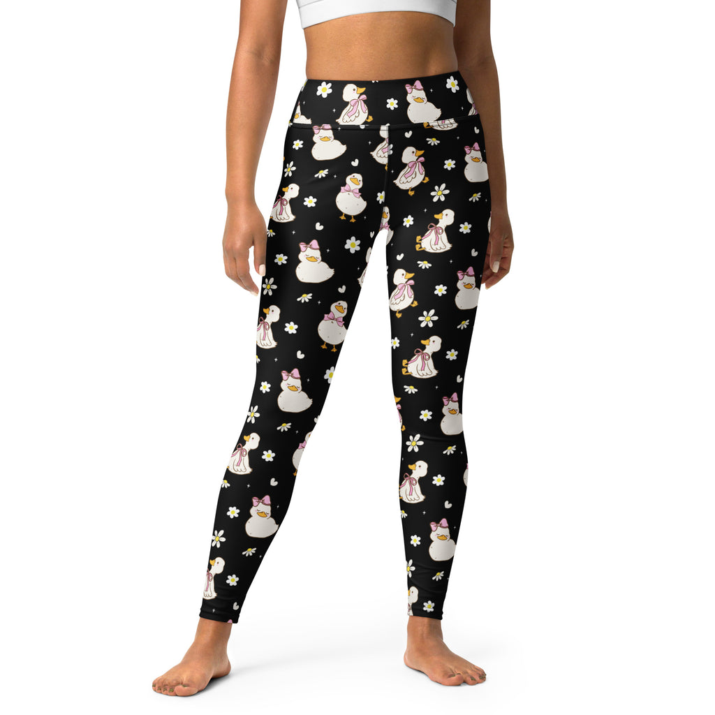 Women’s black buttery soft high waisted yoga leggings with white ducks pink bows and daisies quick drying