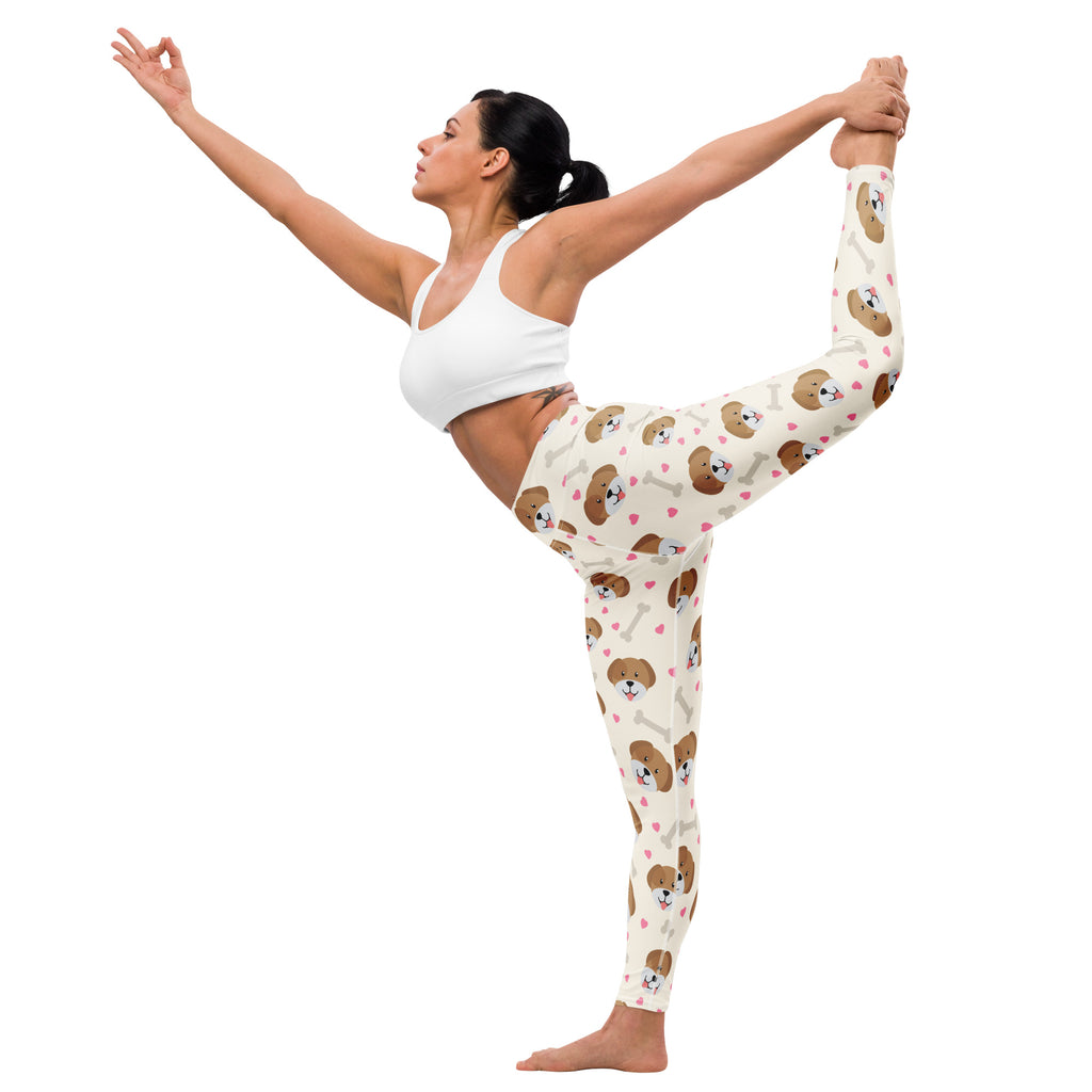 Cream-colored buttery soft women’s yoga leggings with playful brown puppy faces and pink hearts print