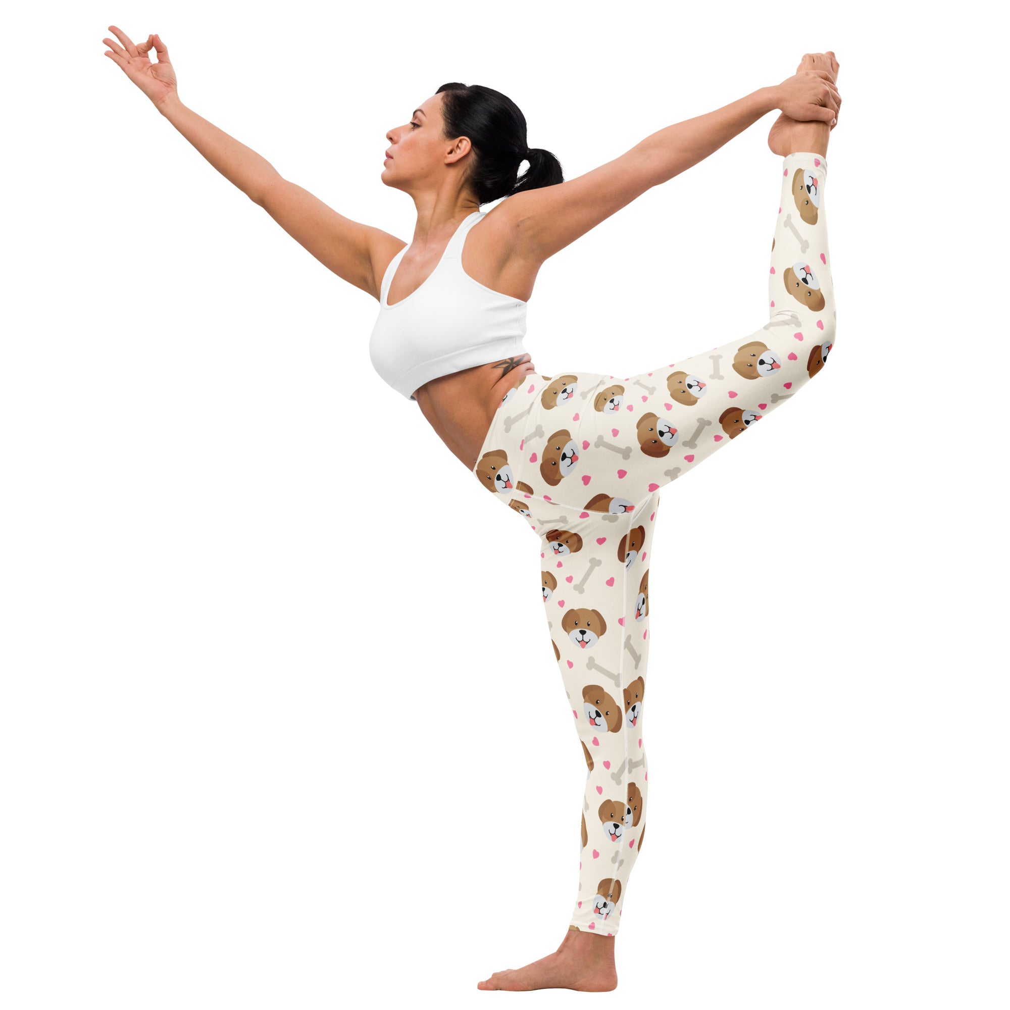 Cream-colored buttery soft women’s yoga leggings with playful brown puppy faces and pink hearts print