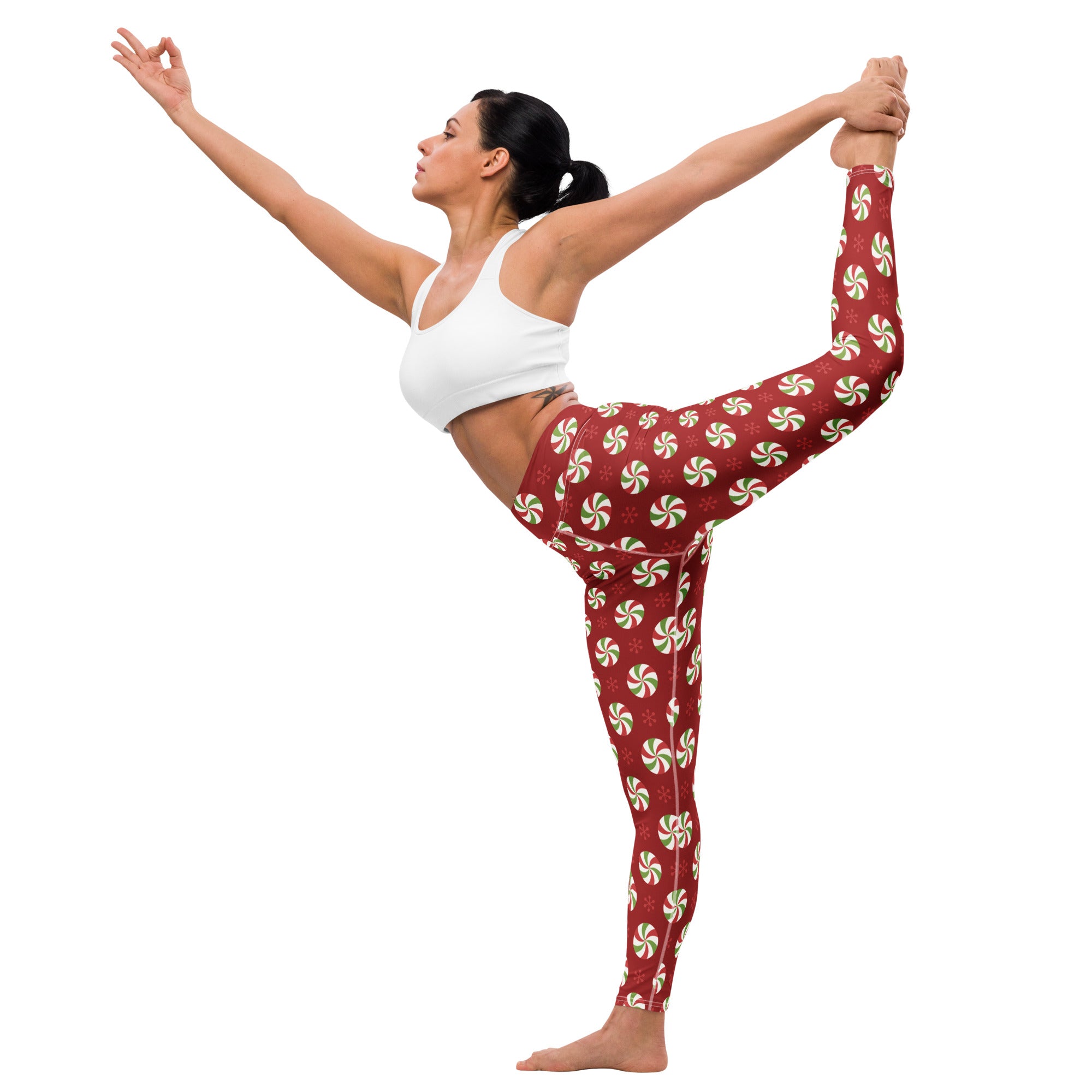 Women’s buttery soft red yoga leggings with green and white peppermint candy pattern for christmas wear