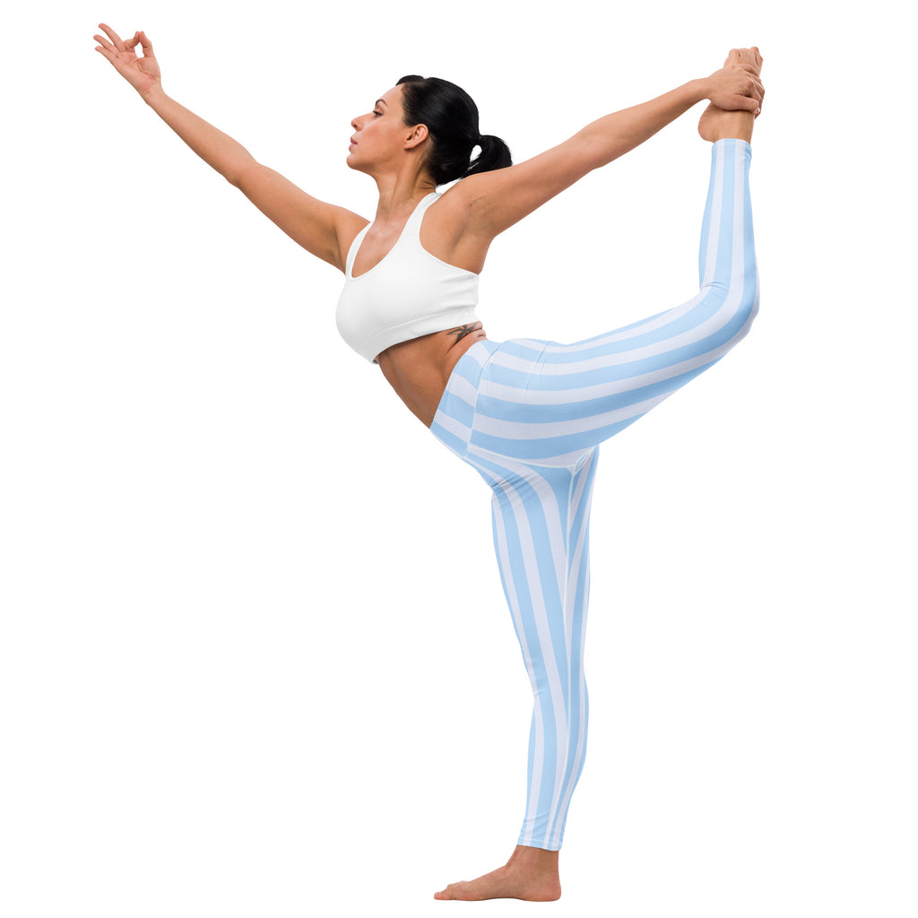 Women’s light blue and white vertically striped buttery soft stretchy yoga leggings shown from the front