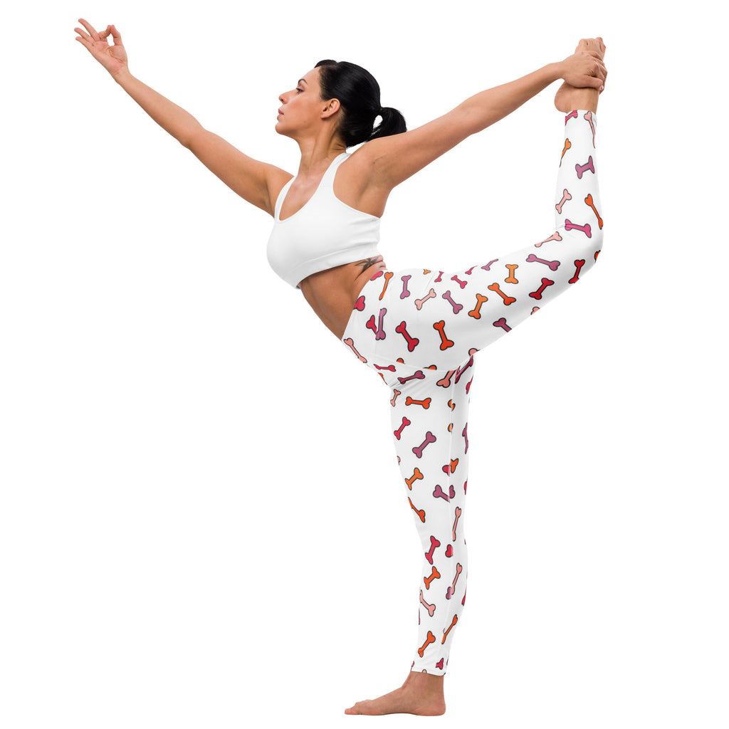 White buttery soft yoga leggings for women with playful multicolored pink orange and red dog bone pattern
