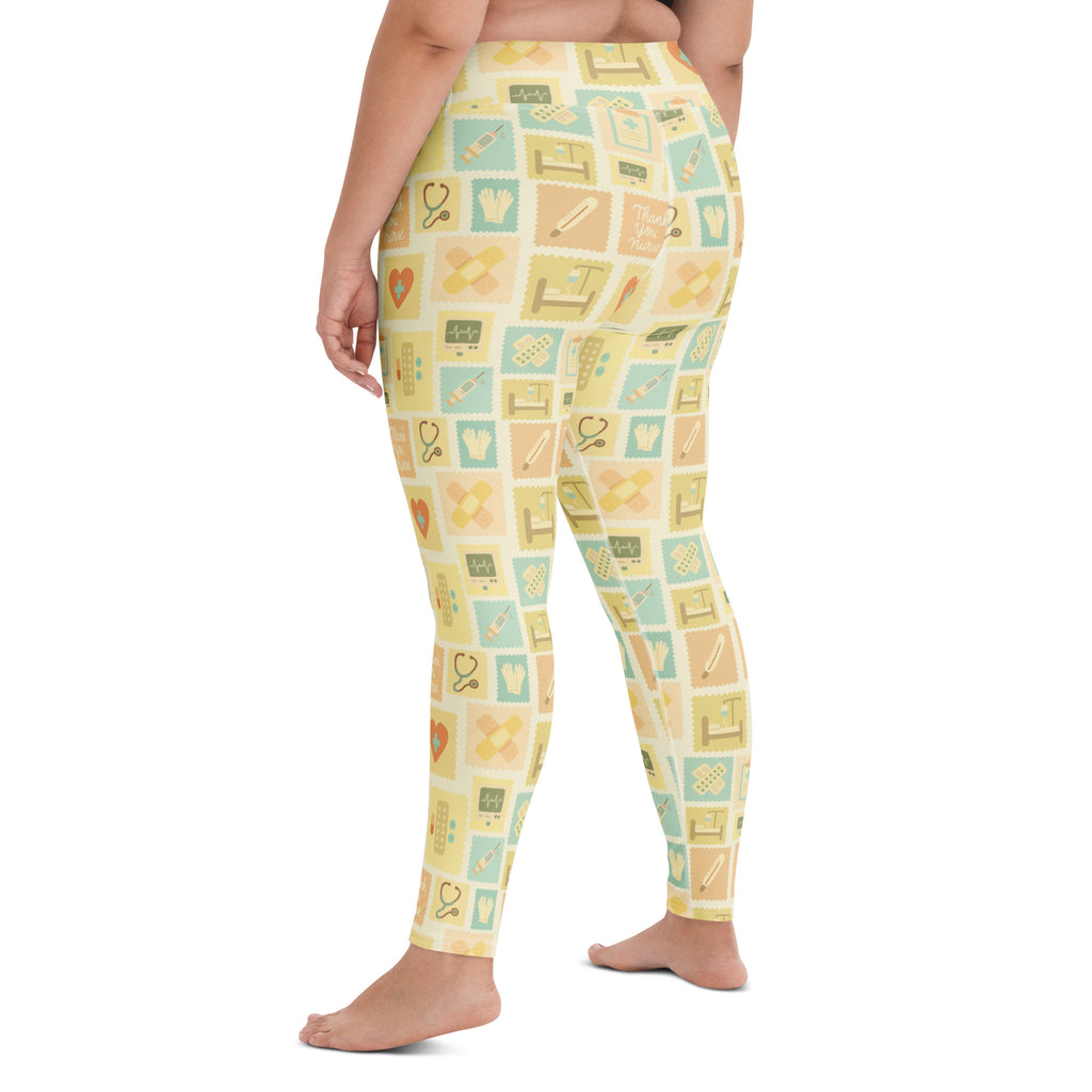Women’s beige buttery soft high waisted yoga leggings with yellow medical icon pattern and quick drying fabric