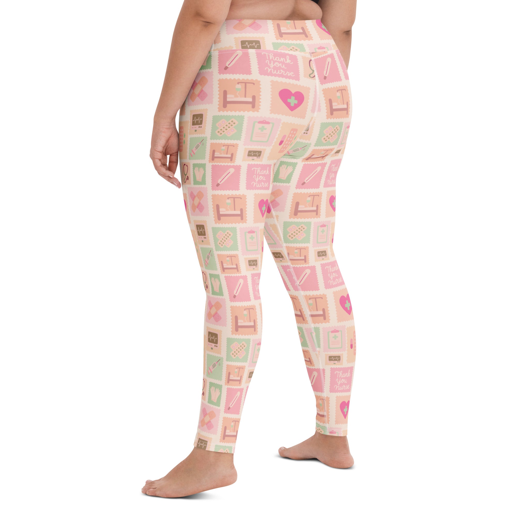 Women’s pink nurse icon buttery soft yoga leggings in pastel pink and mint green with medical illustrations
