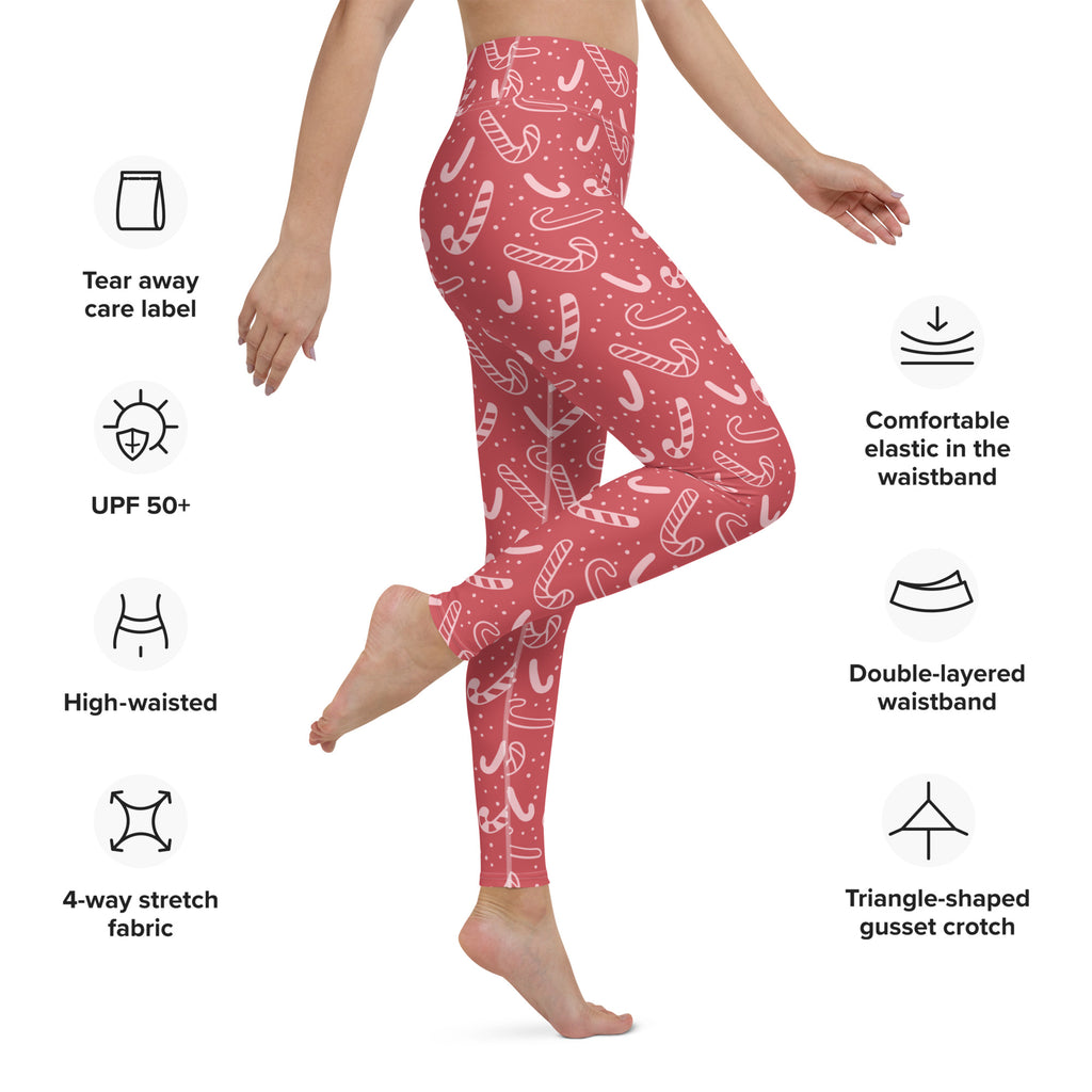 Women’s red candy cane christmas buttery soft yoga leggings in pink with white candy cane pattern