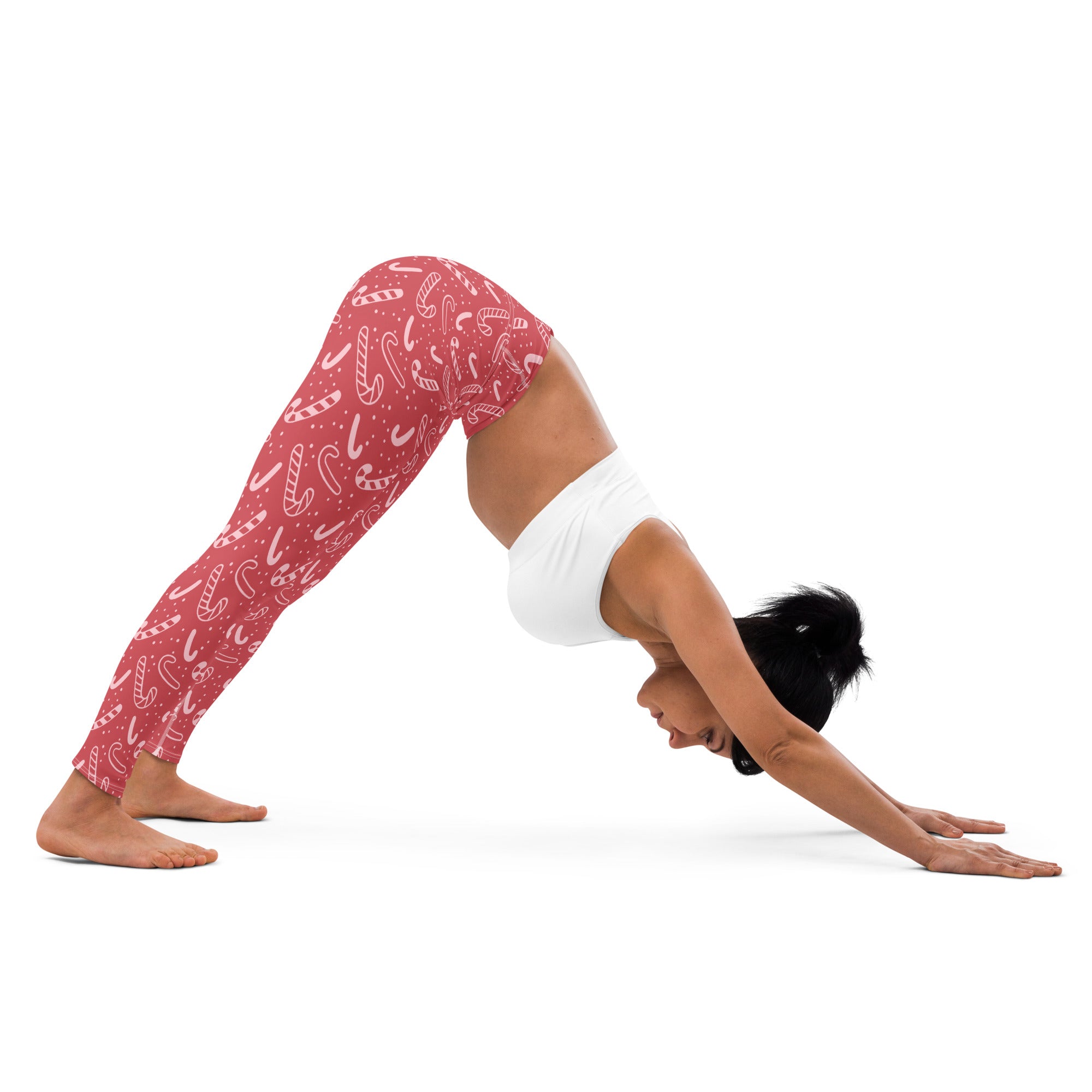 Women’s red buttery soft yoga leggings with white candy cane pattern perfect for christmas workouts
