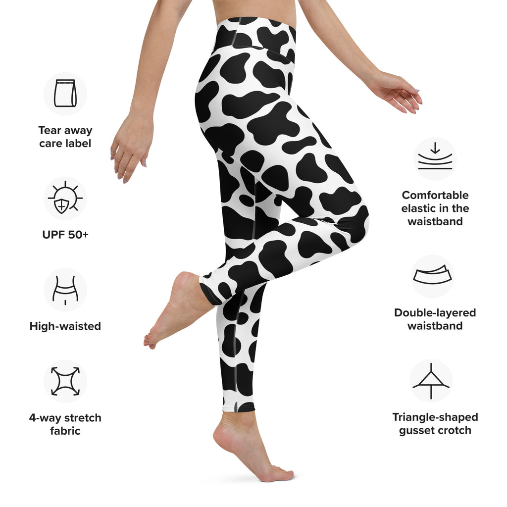 Women’s cow print high-waisted leggings in black and white made of buttery soft 4-way stretch fabric for yoga