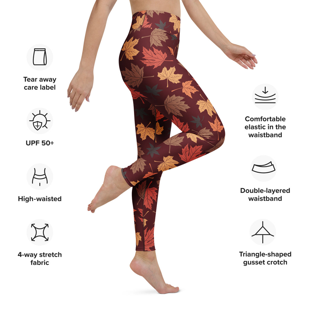 Women’s maroon buttery soft yoga leggings with vibrant autumn maple leaf pattern in orange yellow and brown