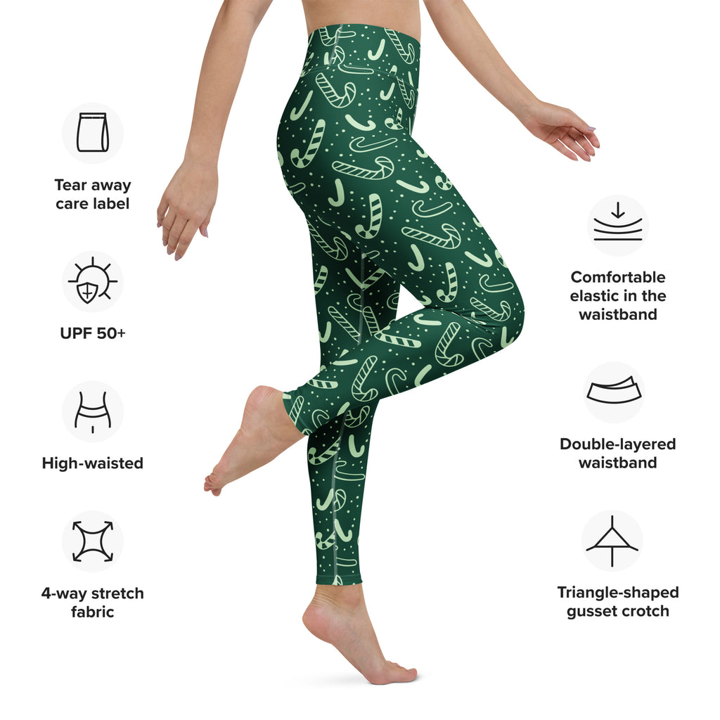 Women’s green buttery soft yoga leggings with festive white candy cane and dot pattern for christmas wear
