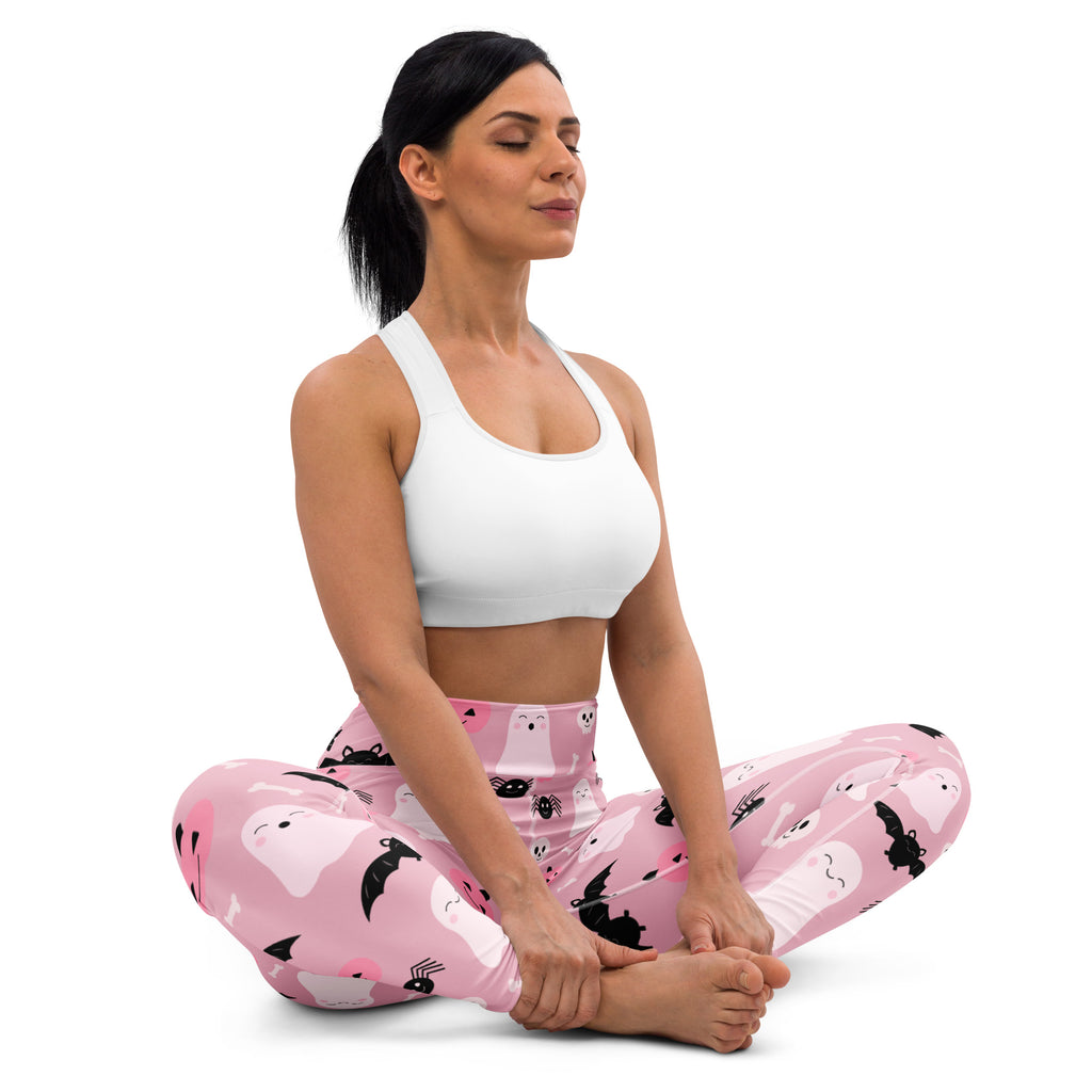 Women’s pink buttery soft yoga leggings with black ghost and bat patterns perfect for halloween wear