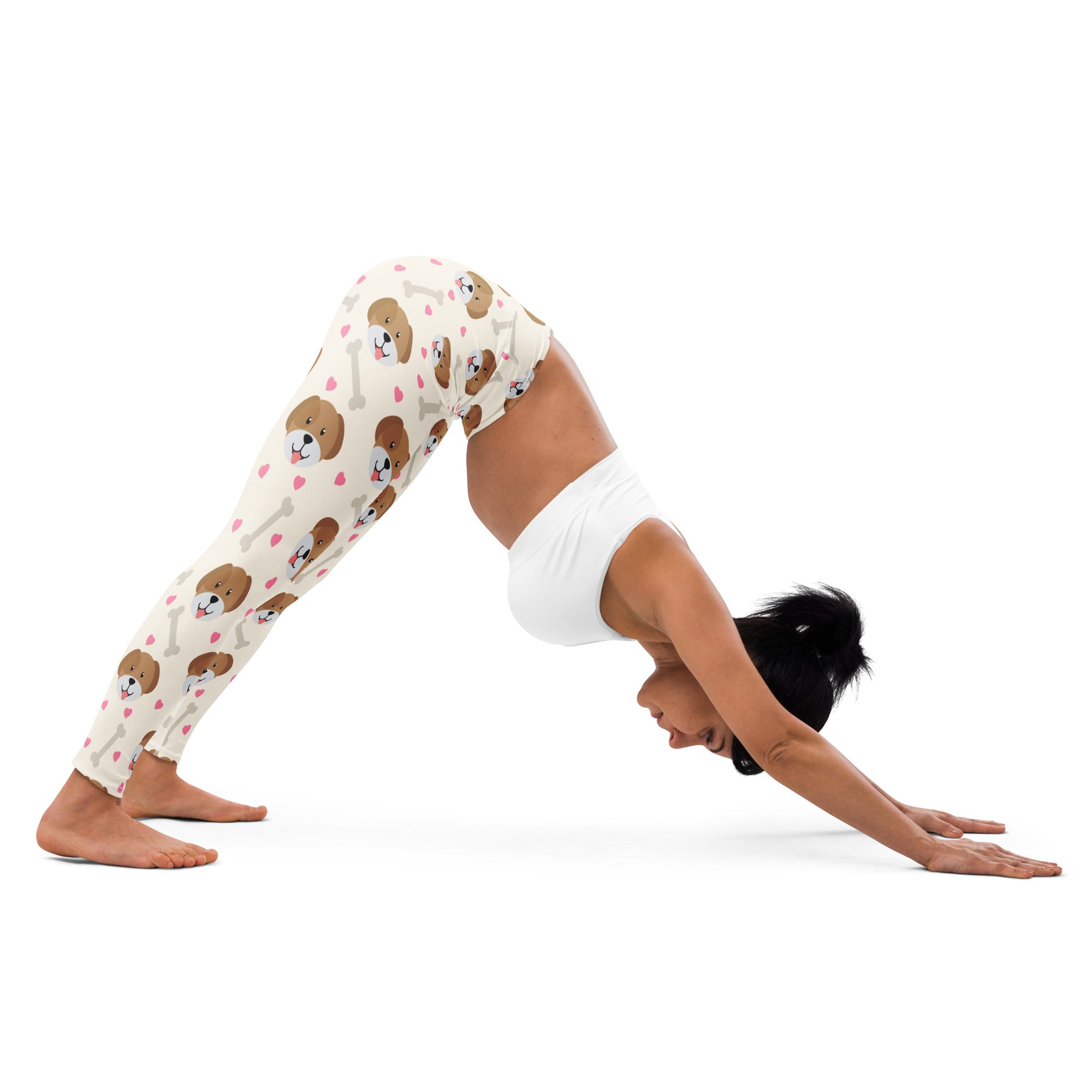 Cream-colored buttery soft women’s yoga leggings with playful brown puppy faces pink hearts and white bones pattern