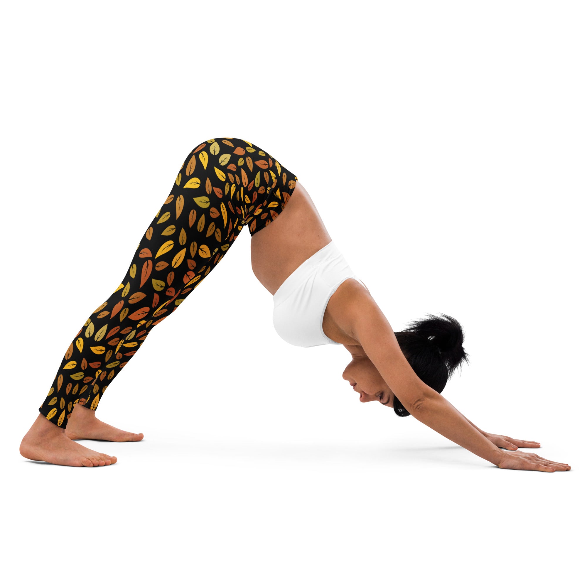 Black buttery soft women’s yoga leggings with gold and orange autumn leaf pattern design