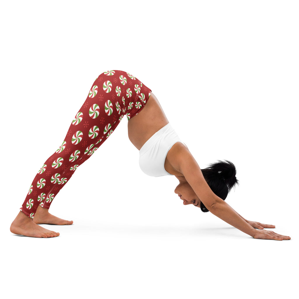 Women’s buttery soft red yoga leggings with green and white peppermint candy festive pattern for christmas