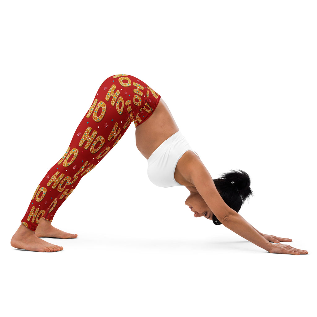 Women’s buttery soft red yoga leggings with festive gold ho ho ho pattern and small decorative accents