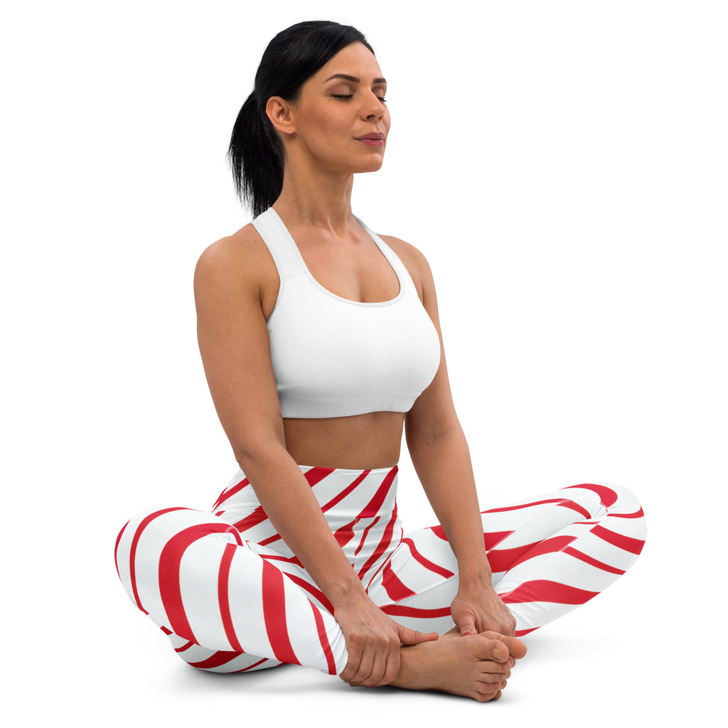 Women’s candy cane stripe buttery soft yoga leggings in red and white striped candy cane pattern shown from back