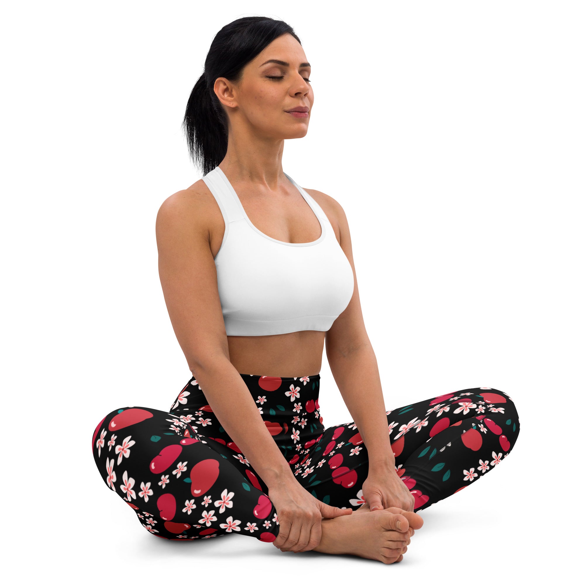 Women’s buttery soft black yoga leggings with vibrant red cherries and pink apple blossom pattern