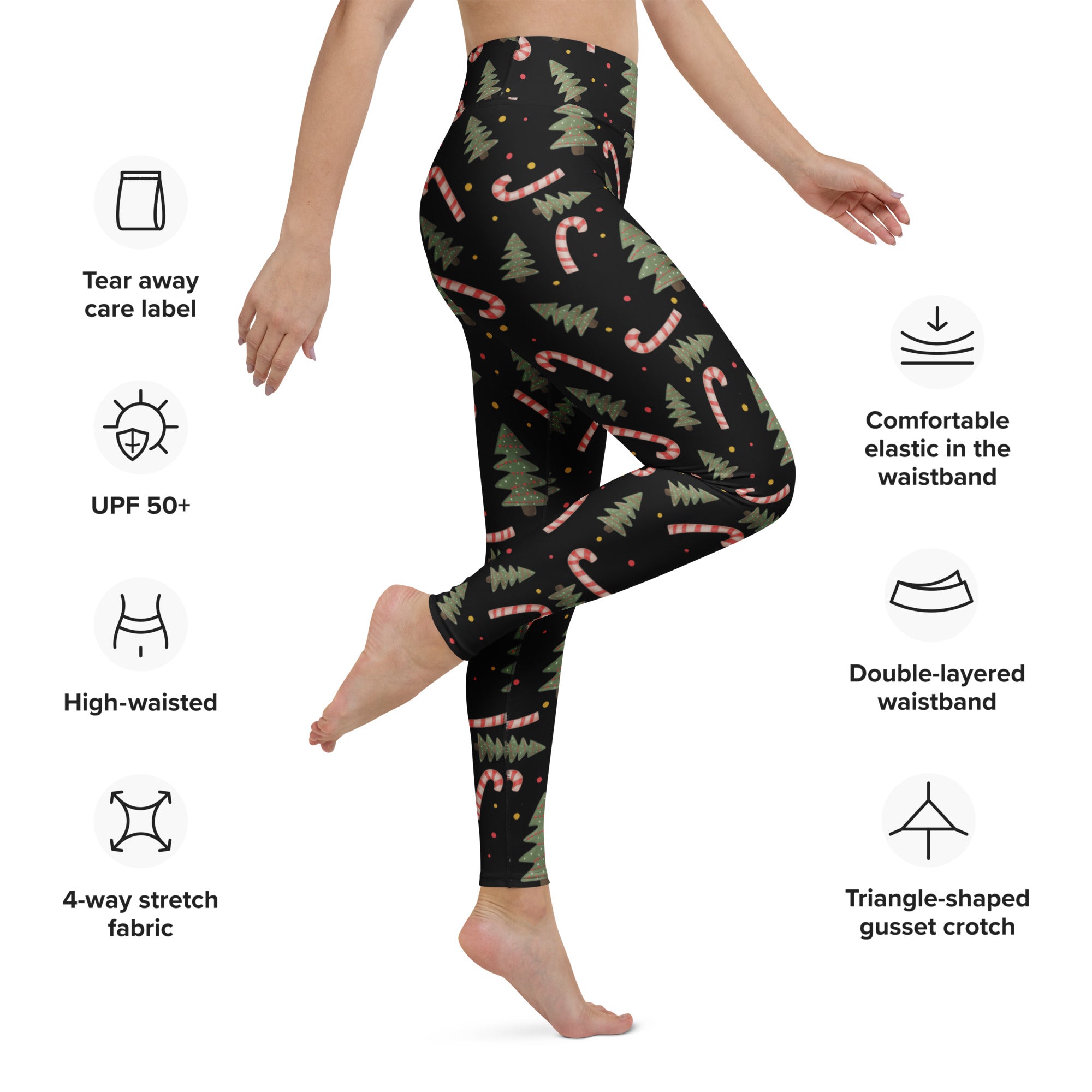 Women’s black buttery soft yoga leggings with festive green pine tree and pink candy cane pattern