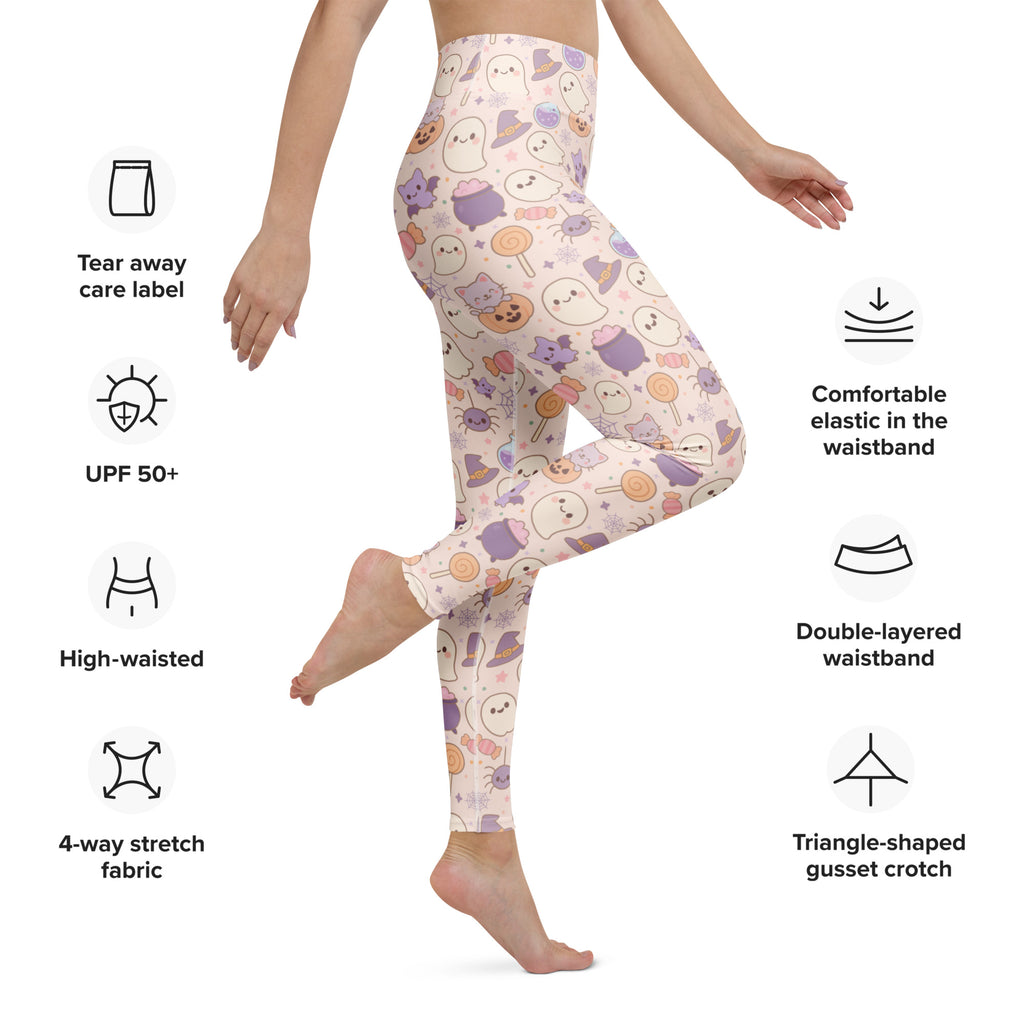 Women’s pastel pink buttery soft yoga leggings with playful halloween ghosts cats and candy pattern