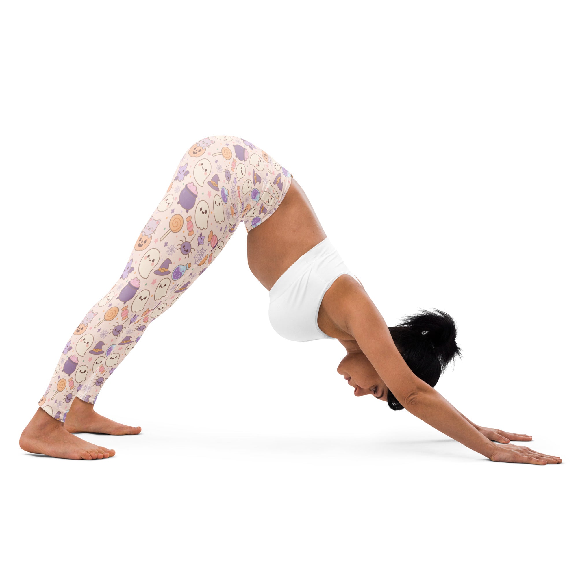 Women’s pastel pink buttery soft yoga leggings with cartoon ghosts and halloween treats pattern