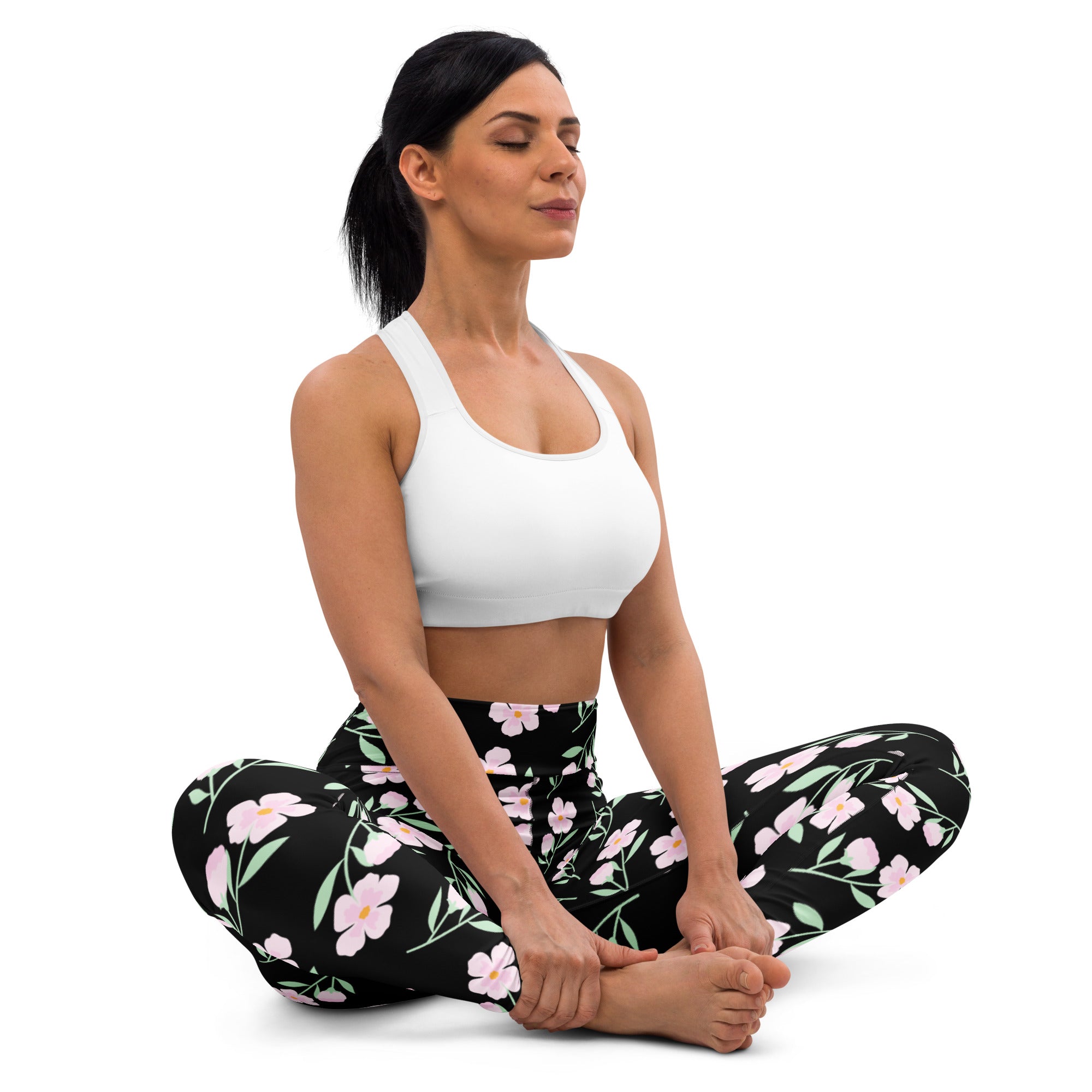 Women’s black buttery soft yoga leggings with pink floral pattern and green leaves