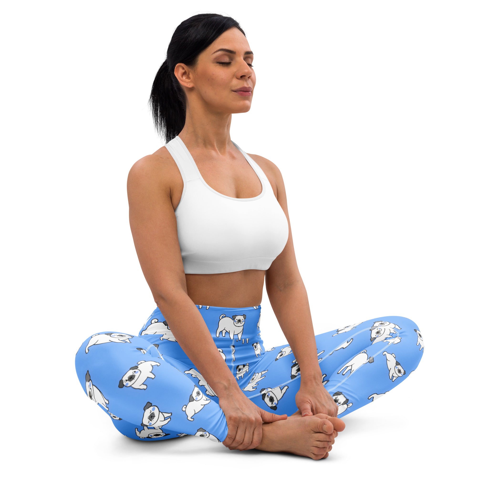 Women’s blue buttery soft yoga leggings with a playful white pug dog pattern in various poses