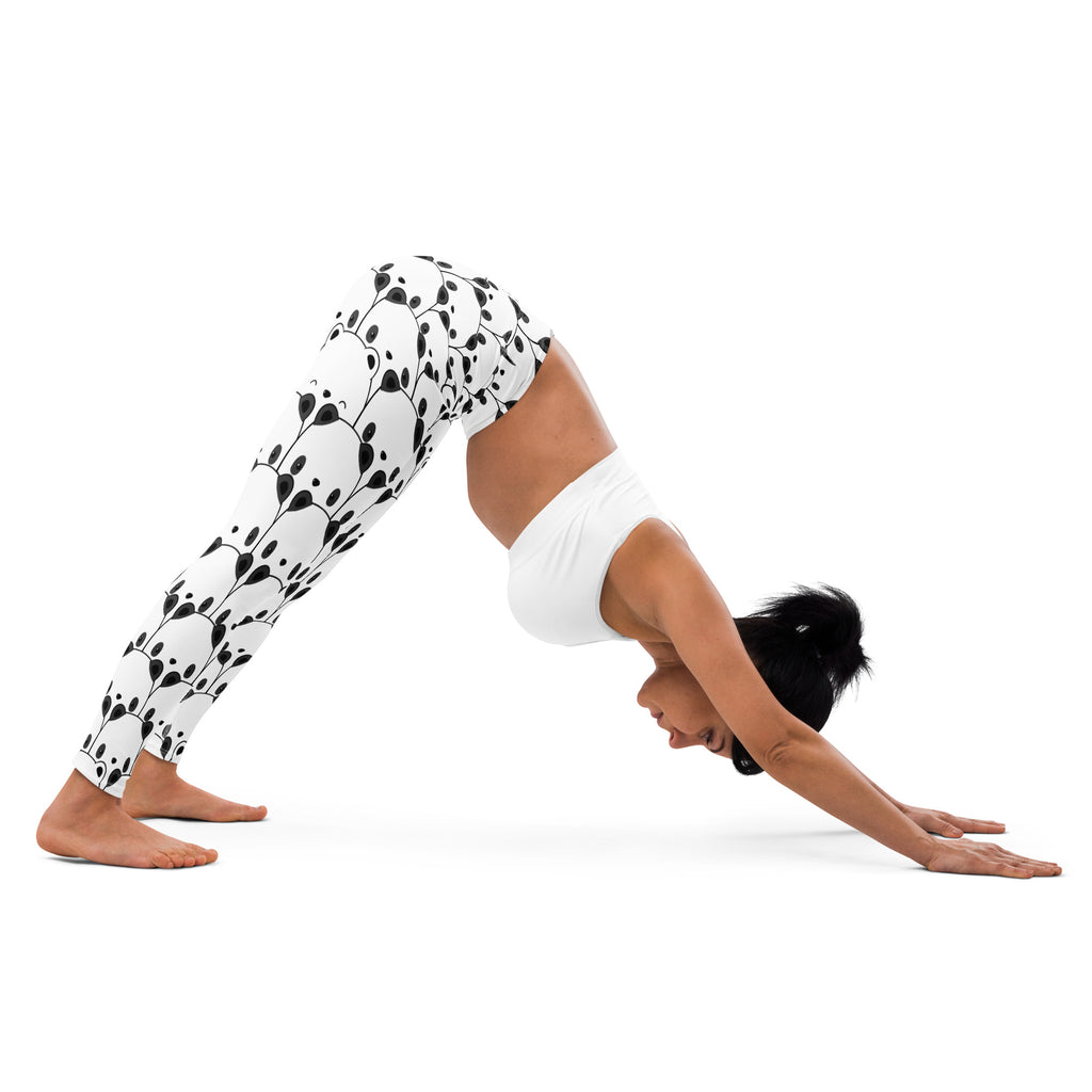 White leggings with black panda face pattern made from buttery soft fabric for women’s yoga and casual wear