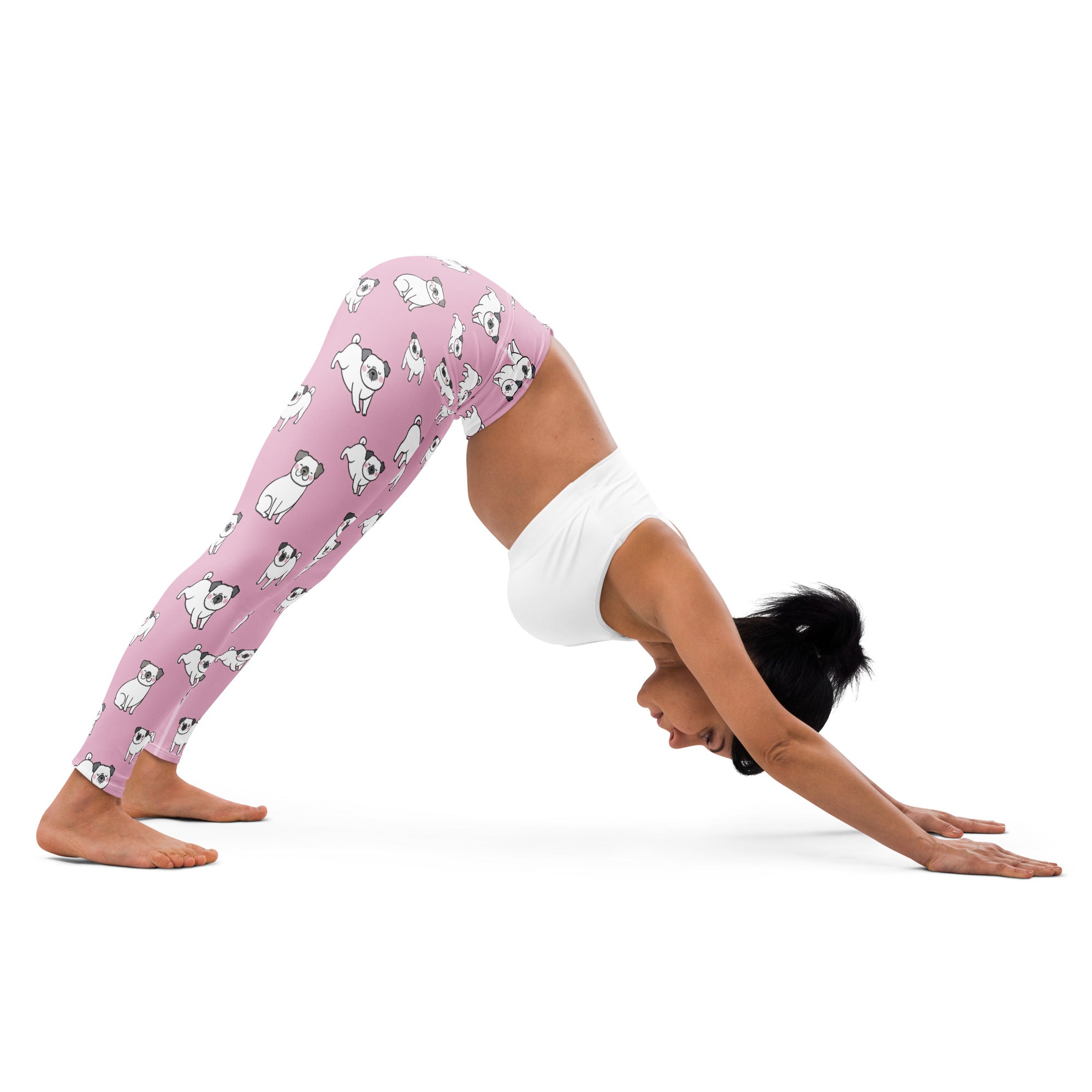 Women’s pink buttery soft yoga leggings with a playful pattern of white pug illustrations