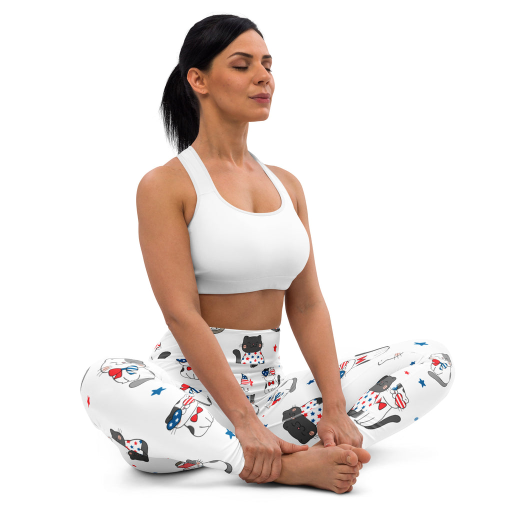 White buttery soft women’s leggings with playful black cats wearing american flag accessories and scattered stars