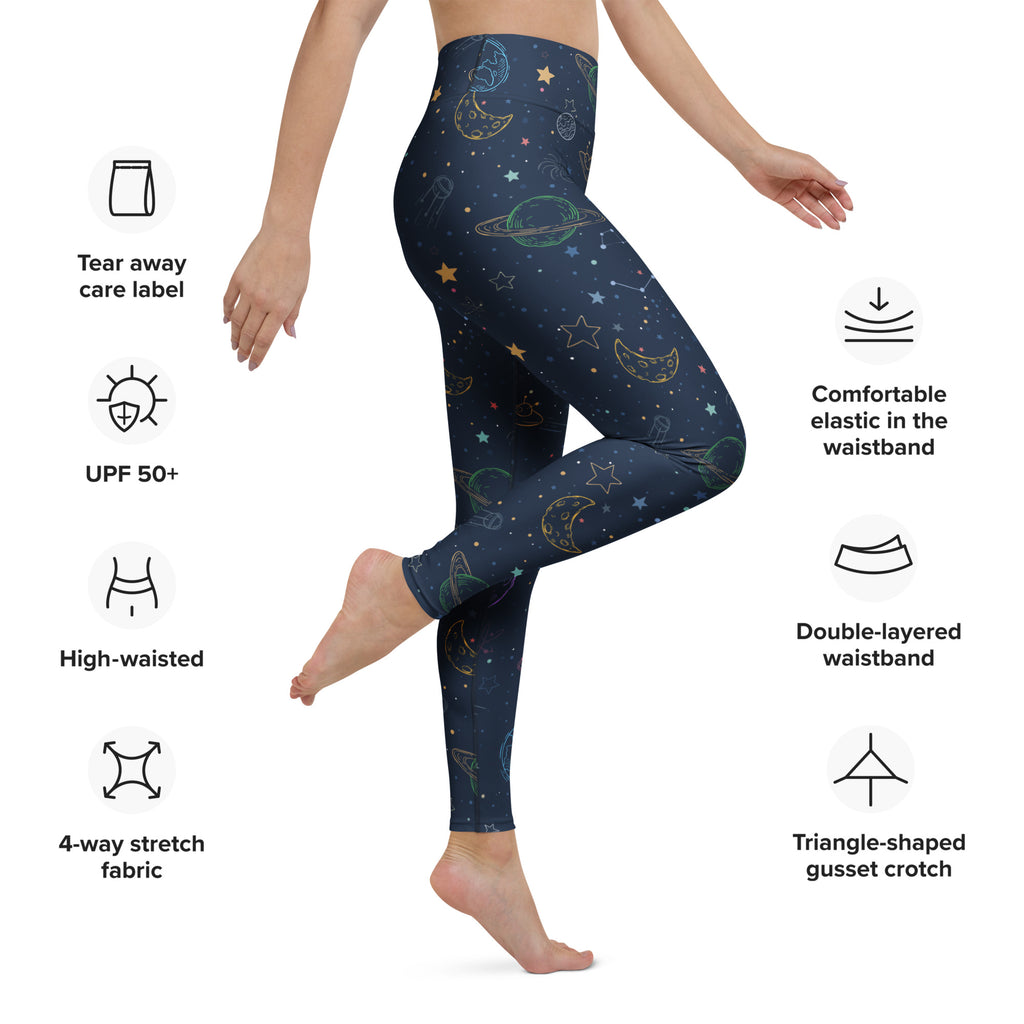 Dark blue high-waisted buttery soft yoga leggings with colorful gold and green celestial moons stars and planets pattern