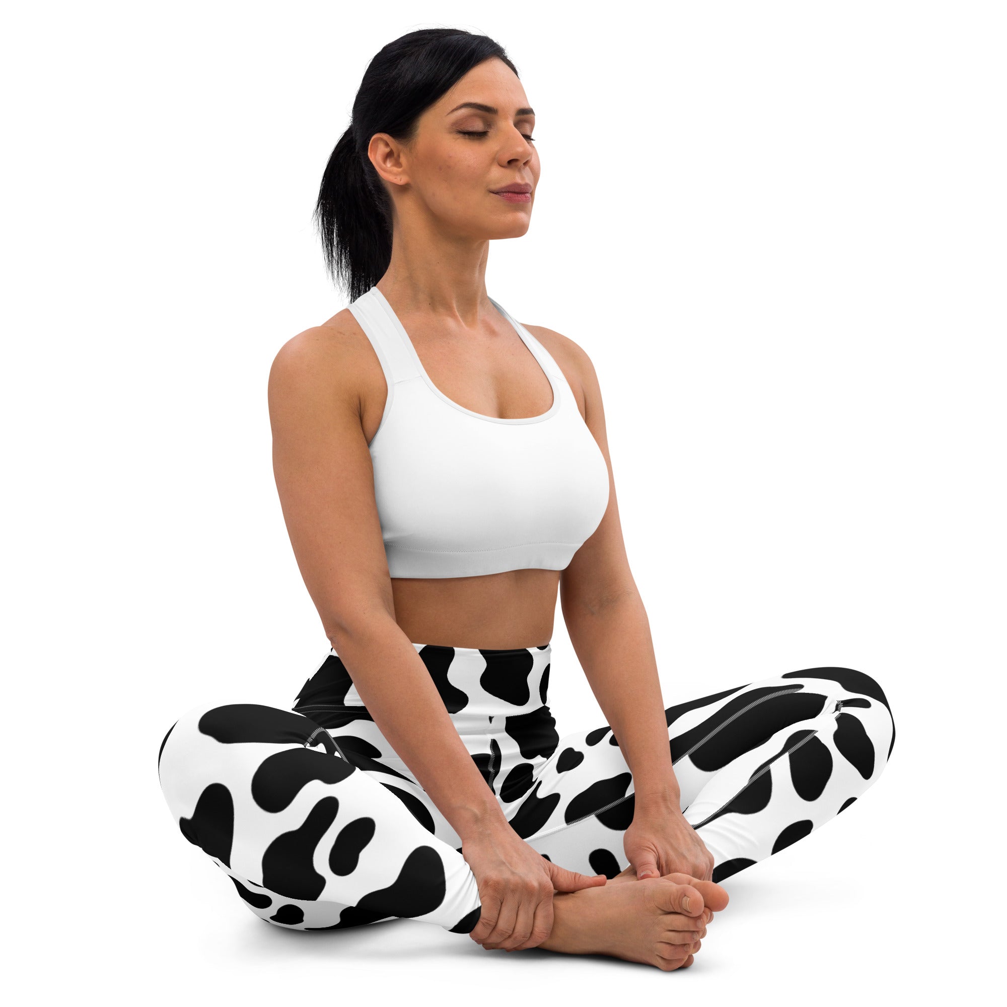 Women’s cow print buttery soft yoga leggings featuring black and white cow pattern in a comfortable stretch fabric