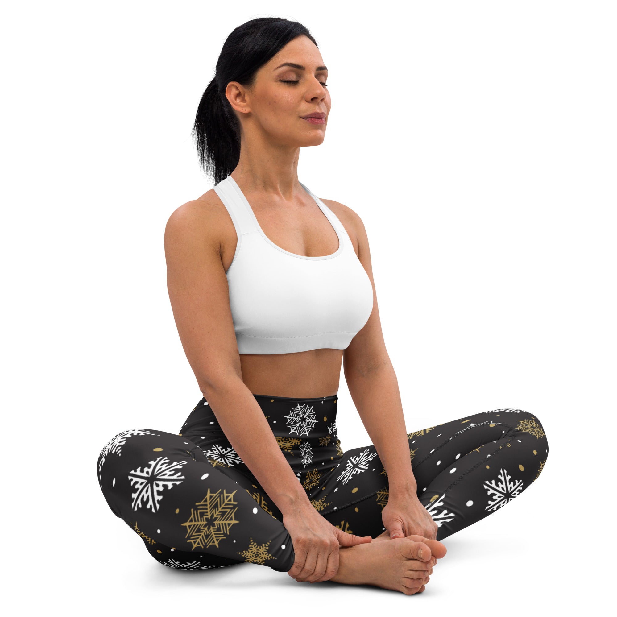 Black women’s buttery soft yoga leggings with white and gold snowflake festive pattern