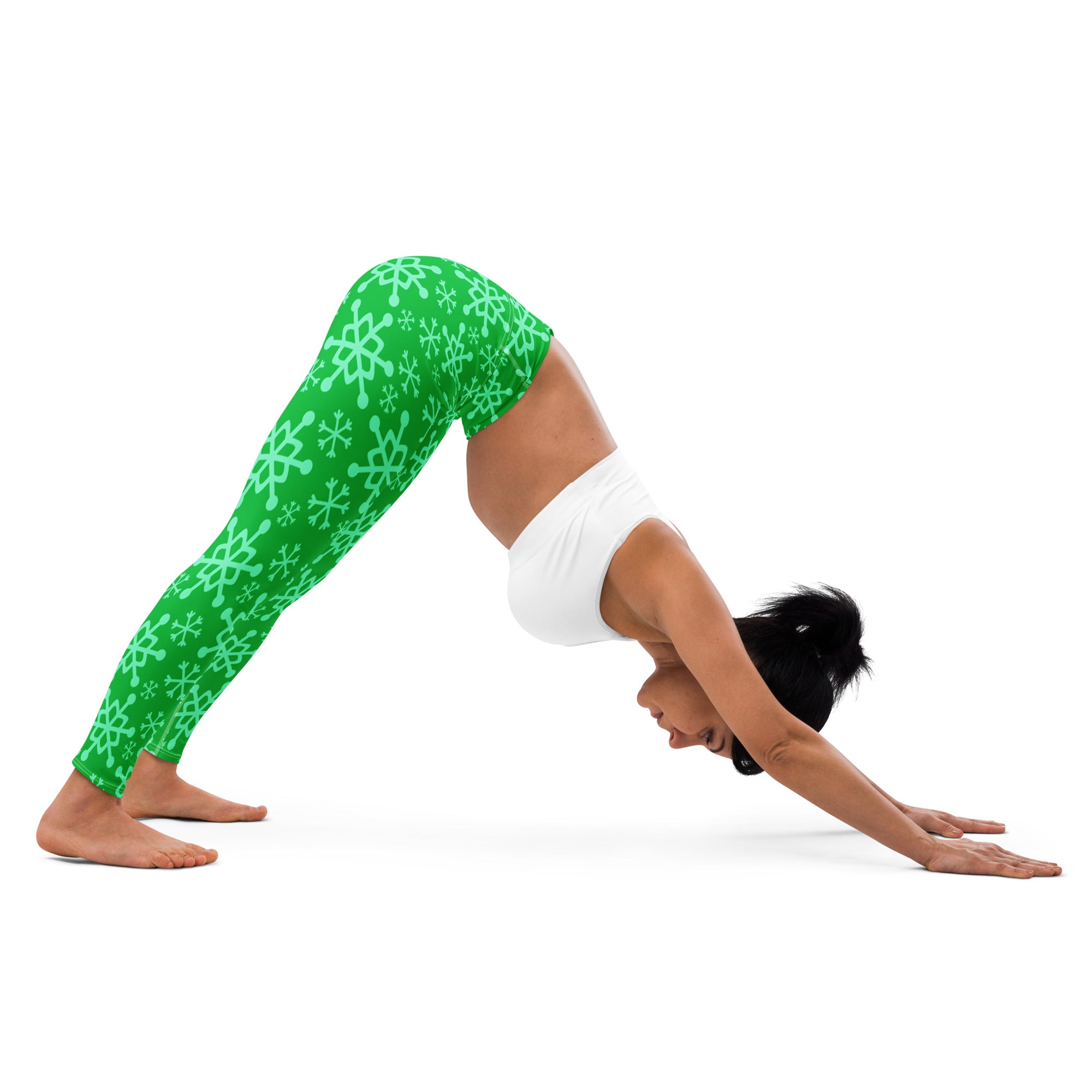 Bright green buttery soft women’s yoga leggings with light mint snowflake pattern for winter workouts