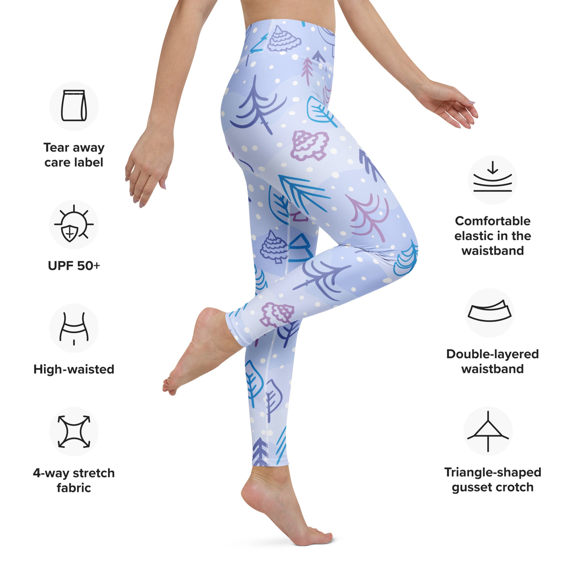 Women’s winter themed buttery soft yoga leggings in light blue with purple and teal tree pinecone and leaf pattern